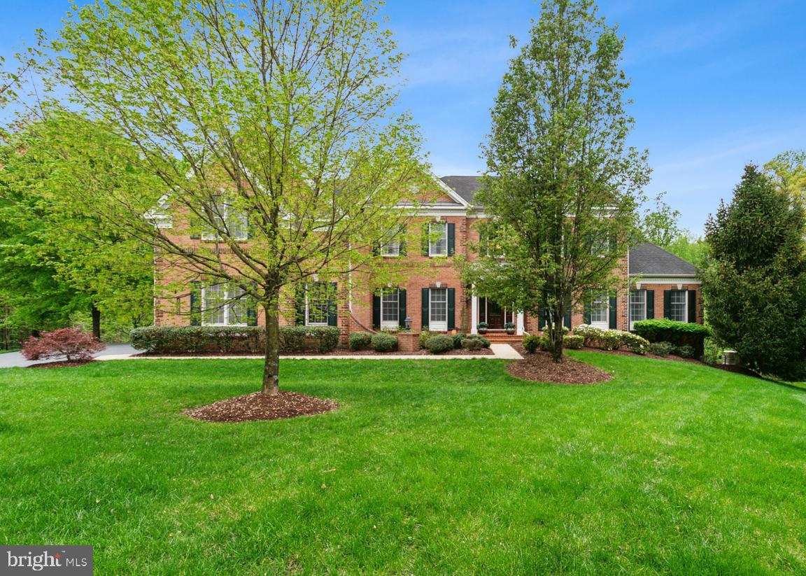 Stately Elegance Meets Luxurious Living in Marlboro Ridge.  Welcome to the Carlton Classic Model by Toll Brothers.  Located in the prestigious equestrian community of Marlboro Ridge, this extraordinary Carlton Classic model showcases over 7,000 square feet of luxurious living space and timeless craftsmanship. Perfectly positioned on a private walk-out premium lot, this home offers grandeur, function, and refined finishes at every turn.  Step into a breathtaking two-story marble foyer, highlighted by a dramatic curved staircase that sets the tone for the sophistication found throughout. With 6 spacious bedrooms, 5 full bathrooms, and 1 half bath, including a main level guest suite with ensuite bath, this home is ideal for multi-generational living and entertaining in style.  The two-story family room boasts soaring ceilings and a cozy fireplace, while the adjacent gourmet kitchen is a chef’s dream, complete with a unique center island, granite countertops, GE Profile appliances, and a bright breakfast area. A private study and formal living and dining rooms provide versatile space for work and leisure.  Upstairs, retreat to a lavish owner’s suite featuring a private den, large walk-in closet, and an elegant spa-inspired bath with soaking tub, dual vanities, and separate shower. Spacious second guest suite has a private bathroom. Additional two bedrooms shares a Jack & Jill Bathroom, and a rear staircase ensures seamless connectivity.  The fully finished lower level is a true entertainer’s haven, with a recreation room, media room with surround sound and seating for 10, and plenty of room for future expansion.  Step outside to enjoy the elevated deck and brick patio below, complete with two ceiling fans, offering comfort and style for outdoor gatherings. Additional features include nine-foot ceilings on the main and upper levels, a whole-house generator for peace of mind, and thoughtful design elements throughout.  Live the lifestyle you've imagined—luxury, space, and serenity—in one of Prince George’s County’s most sought-after communities. Welcome home to Marlboro Ridge.