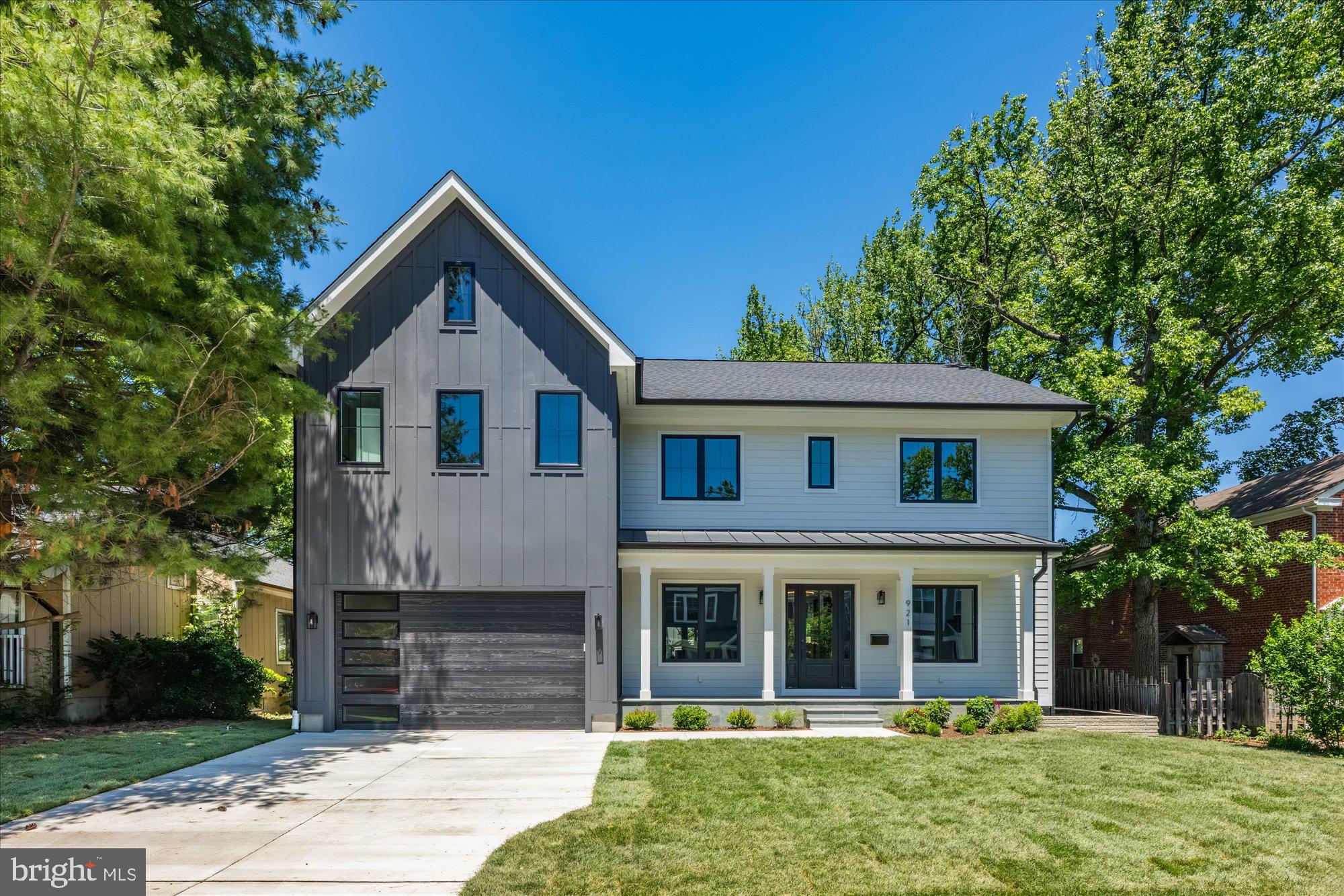 Welcome to this beautiful new custom home in Aurora Highlands, now finished and ready to move in. This home features 6 bedrooms, 5 full bathrooms, and one powder room with 5,563 square feet of finished living space over three levels. The main level includes 10ft ceilings, gorgeous wide-plank engineered white oak wood floors, a beautiful gourmet kitchen with custom cabinetry, quartz countertops, Thermador appliances, and a spacious walk-in pantry. The kitchen overlooks a great room with accented wood beams and gas fireplace set in a fluted tile wall. The deck off of the great room provides an amazing outdoor living space overlooking the backyard. Through the butler's pantry is an elegant formal dining room with abundant natural light. A private study and a mudroom with built-in cubbies and attached walk-in closet complete the main level living spaces. The upper level includes five bedrooms, highlighted by a luxurious primary suite with a private balcony, spacious dual walk-in closets with built-ins, and a spa-like bathroom with double vanities, stand-alone soaking tub, and heavy glass enclosed shower. The walk-up lower level includes a spacious recreation room with walk-behind wet bar, exercise room, and an additional bedroom with full bathroom. The professionally landscaped 9,000 sq ft lot is flat and perfect for entertaining and play. This home is designed and developed by Keel Home Development and built by EQ Builds. Convenient to all of the shops and restaurants of Crystal City / National Landing, Army Navy Country Club, and much more.