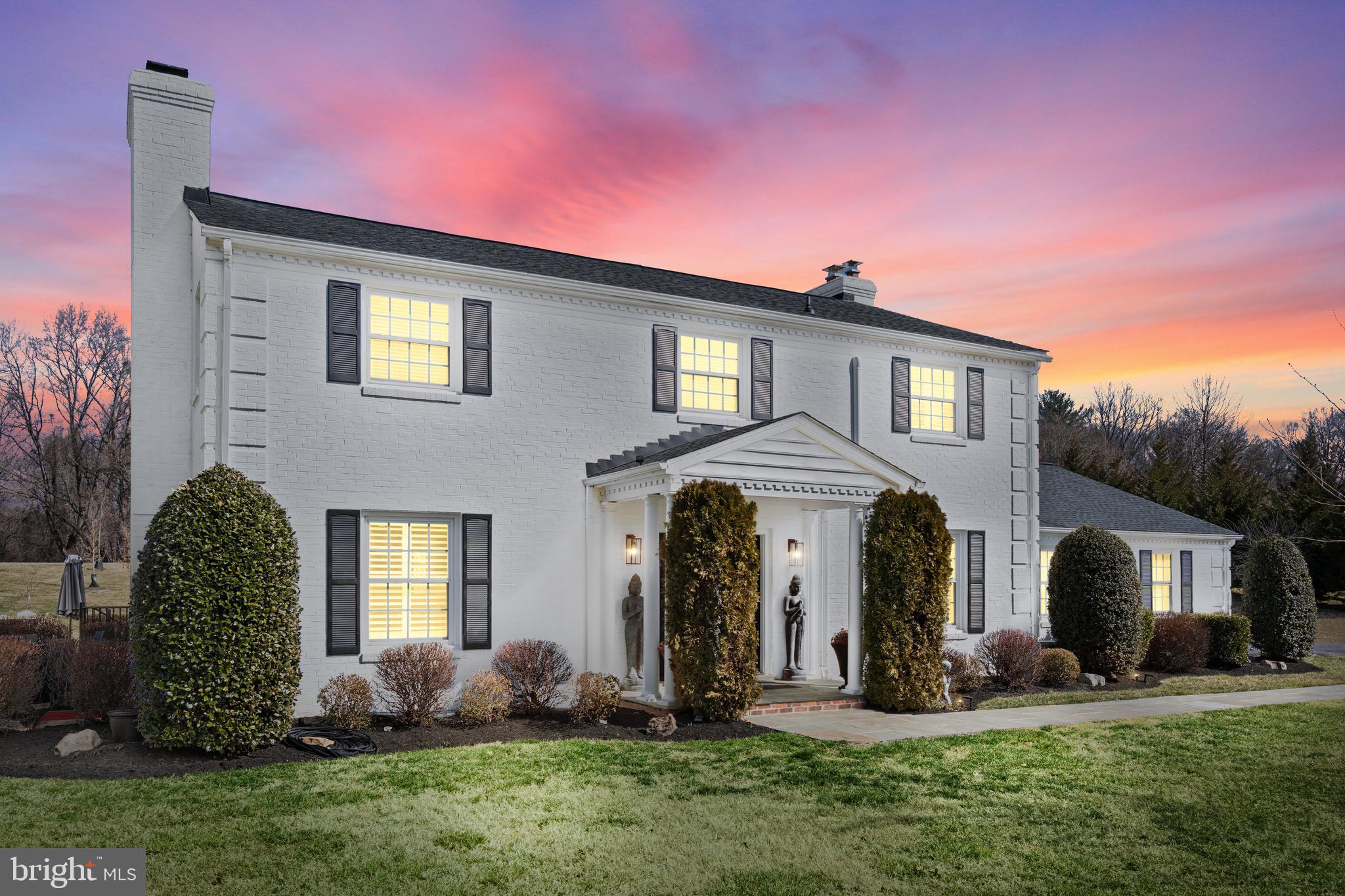 ***OPEN HOUSE CANCELLED FOR SATURDAY, MARCH 8TH***Do not miss your chance to own this private oasis on nearly two acres of beautifully landscaped grounds, just minutes from Dulles International Airport and Washington, DC. Ideally located near the Fairfax County Parkway, Dulles Toll Road, Tysons Corner, Route 7, I-495, and Reston Town Center, this home offers a rare combination of seclusion and convenience, providing easy access to major destinations.

Nestled in the picturesque equestrian community of Westford, this exquisite all-brick colonial embodies timeless elegance and modern sophistication. Designed for luxurious living and effortless entertaining, the home welcomes you with gleaming hardwood floors and an abundance of natural light.

At the heart of the home is the beautifully designed chef’s kitchen, a masterpiece of both function and style. High-end Wolf cabinetry, premium appliances, and a striking quartz countertop are complemented by a dazzling Austrian crystal backsplash. A spacious center island, complete with bar-height seating, a vegetable sink, and a Jenn Air downdraft cooktop, provides an ideal space for meal preparation and casual dining. The kitchen seamlessly flows into the warm and inviting family room, where a cozy fireplace creates the perfect ambiance. Beyond this open-concept space, the formal dining and living rooms offer picturesque views throughout.

The main level also features a dedicated office, a fully renovated powder room at the front entrance, a mudroom with a laundry area and a second powder room, and convenient access to the backyard. Step outside onto the expansive covered veranda, designed for year-round enjoyment with four ceiling fans and breathtaking views of the landscaped grounds. This outdoor retreat is perfect for dining al fresco and entertaining guests. The backyard is a true sanctuary, featuring a hot tub, a mounted outdoor TV, a paved patio, an expansive wood-burning firepit, and a fully finished shed with stamped concrete floor, recessed lighting, and mini-split cooling and heating system. It offers the tranquility of a private park within the comfort of home.

The upper level showcases four spacious bedrooms, all with hardwood floors and three beautifully updated bathrooms with marble and tile floors. The luxurious primary suite features a spa-inspired bathroom with marble flooring and tile, a double vanity, a soaking jacuzzi tub, and separate walk-in tiled shower. A secondary bedroom, spacious enough to serve as another primary suite, includes an en-suite bathroom with a double vanity, 2-person fully tiled shower, and designer tile. Two additional generously sized bedrooms share a hall bathroom, also thoughtfully updated with a double vanity and quartz countertops.

The fully remodeled basement provides even more living space, featuring two additional bedrooms, a renovated full bathroom, a bonus room/den, a built-in wet bar, a recreation room, and a gym. With a walk-up entrance, the basement offers endless possibilities for relaxation, entertainment, or extended guest accommodations.

With extensive updates throughout and every detail thoughtfully considered, this home is truly a rare gem. A full list of updates is available in the MLS. Schedule your showing today—this exceptional property will not be available for long