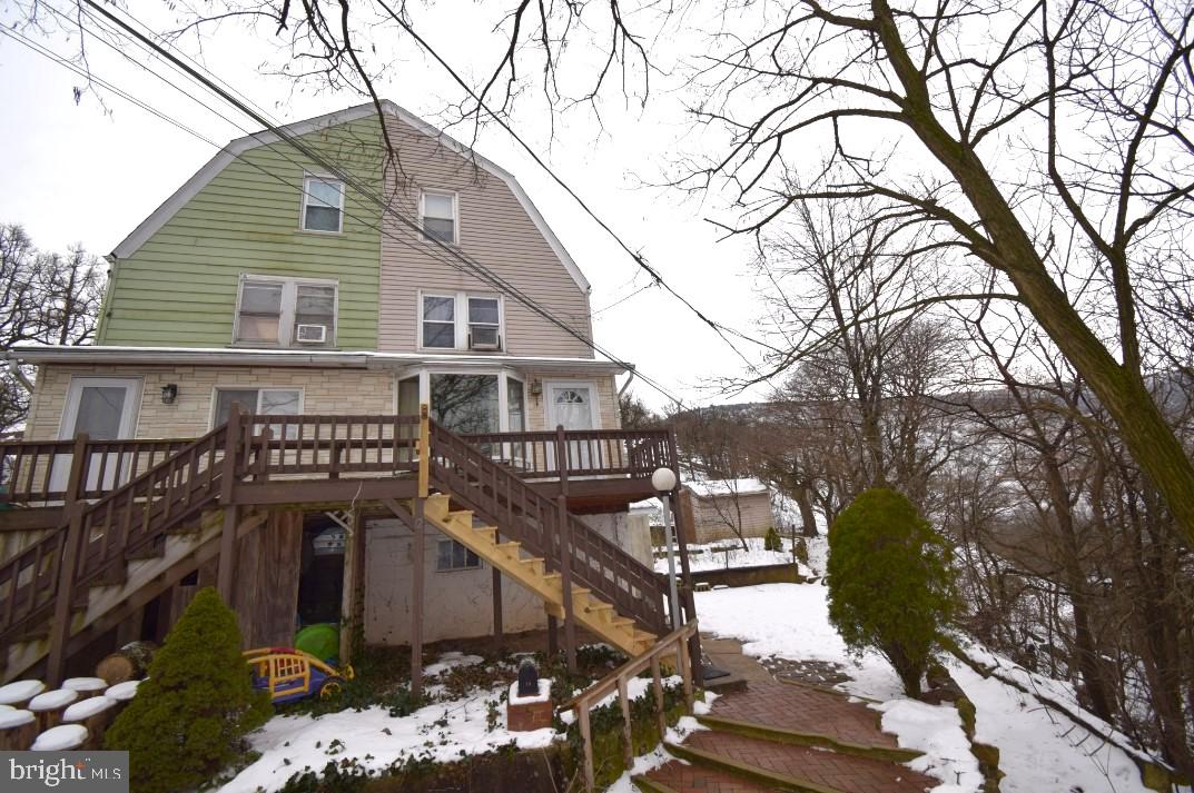 Discover the untapped potential of this charming twin home in Palmerton! Just below historical Marshall's Mansion. Enjoy breathtaking views of the mansion on the hill from the comfort of your own home! Featuring 4 bedrooms and 1 bath, this home provides a cozy and intimate atmosphere. The spacious kitchen is a canvas awaiting your personal touch, ready to become the heart of your home. Ascend to the third floor, where you'll find nearly finished square footage, presenting an exciting opportunity to expand your living space. Endless options for finishing - playroom, home office, 3rd and 4th BR - easy to add value. Public parking lot just a few second walk away. Unlock the potential of this Palmerton gem and make it your own.