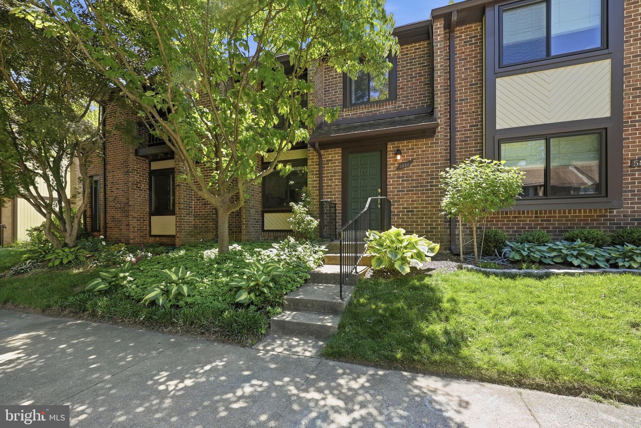 Gorgeous all brick 3-bedroom, 2 full bath, 2 half bath townhouse in Burke Centre with wooded views! Welcome home to an entry foyer followed by an eat-in kitchen complete with quartz counters, stainless steel appliances and pantry. An open dining room flows into a family room with recessed lighting (2023) and fireplace. The main level flooring is all new as of 2023. Step outside to a rear deck (2024) that’s perfect for entertaining. Upstairs a large primary suite with updated bathroom and large closet with California Closet custom built-ins features a private balcony. Down the hall two more bedrooms share a hall bath with brand new flooring. The lower level features a large rec room with recessed lighting and wood-burning insert and opens to a lower deck overlooking the rear tree save.  A spacious laundry room, bonus storage room and half bath complete the lower level. New HVAC in 2023 and New Dryer in 2025. A tot lot is just outside the back doors of the townhouse. All this with 2 reserved parking spaces and Burke Centre amenities like walking trails, pools, tot lots, basketball courts and just steps to the Burke Center Shopping Center. Ideally located with easy access to Ox Road, Burke Center Parkway, Fairfax County Parkway and Braddock Road. Robinson High School Pyramid!