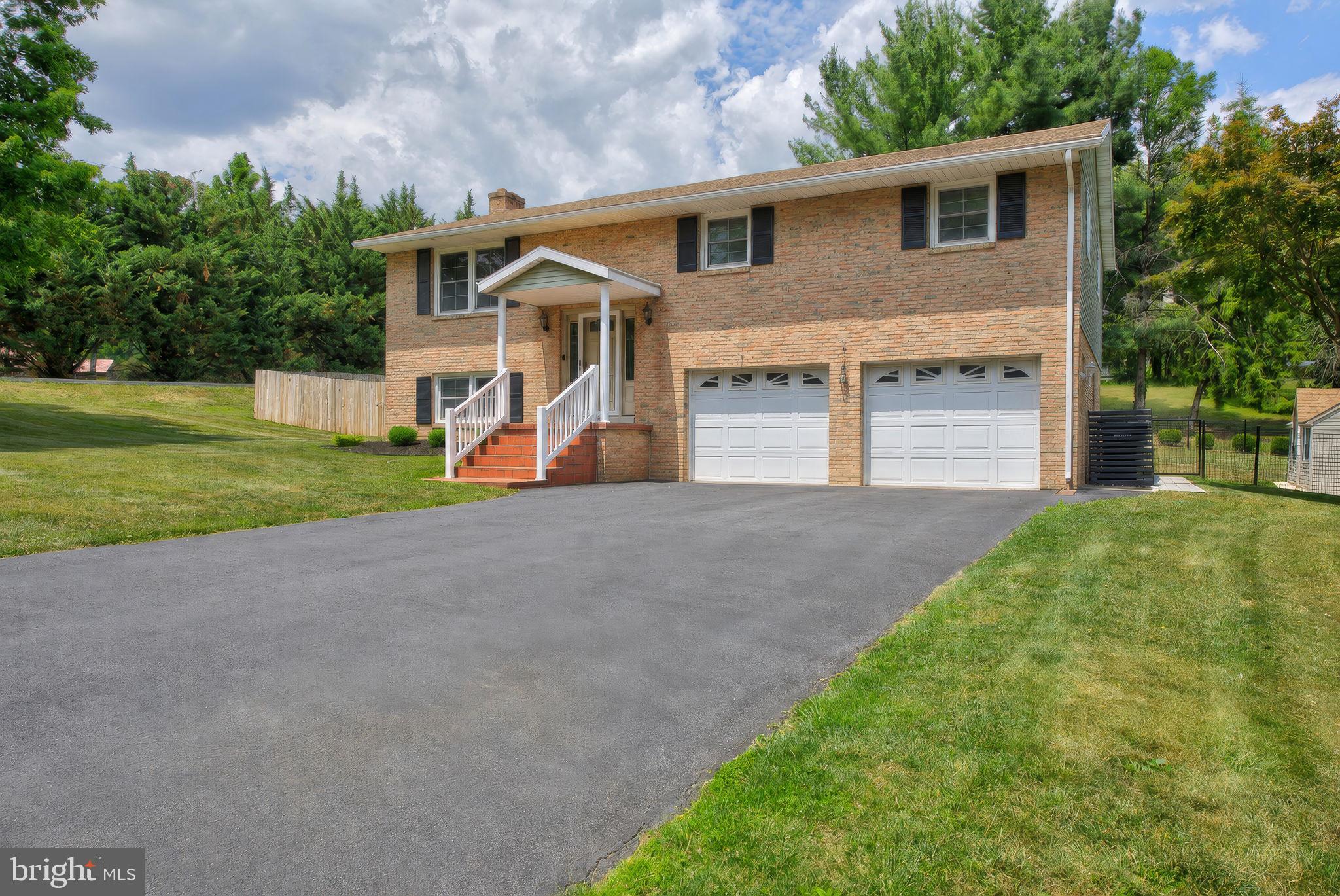This home is situated on an approximately 0.44-acre lot with about 1,960 square feet of living space. 

There are 3 bedrooms and one full bath on the upper/main floor.  Flooring throughout the home has been replaced, with fresh paint, new bathroom fixtures, ceiling fan and lighting added as well!  In the kitchen, the dishwasher and microwave are also new.  With the dining area separate from the kitchen you will find plenty of space for your needs.  

The lower level is just as nice with a cozy family room supplemented with a wood burning fireplace.  Not only is there a half bath and laundry on this floor but there is a 4th room that is finished to be used for an additional bedroom/office/flex space, a huge bonus to the home!  It is on this level that you can access the garage in addition to a separate access to the back yard.  A new patio has been added right outside this entrance area to the home, along with a beautiful wood fence.