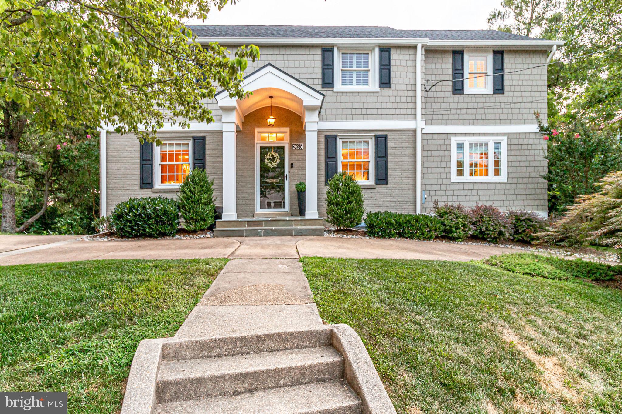 Welcome to this beautiful 5 Bedroom, 3 and 1/2 Bathroom move-in ready home located just 2 lights to DC and only 1 block to Potomac Overlook Park and Donaldson Run Pool.  Backing to parklike land, the home is sited on a private, fully fenced and flat 0.3 acre lot. Designer influences throughout include custom window treatments, updated lighting, custom built-ins and millwork, and hardwood floors. The main level features a gorgeous eat-in Kitchen with granite counters, stainless steel appliances, a bar with dual zone wine and beverage fridge, and direct access to the expansive rear deck - ideal for outdoor entertaining!  An expansive Family Room with gas Fireplace, built-in surround sound, multiple custom built-ins and window seat is the perfect spot to relax, connect, or gather with friends and family. The Dining Room is adorned with a designer chandelier and also opens directly onto the rear deck.  A formal Powder Room with whimsical finishes completes the main level.  The upper level has 4 Bedrooms with hardwood floors and 2 Full updated Bathrooms.  The Owners Suite enjoys two generously sized walk-in closets, plantation shutters, recessed lighting, and Bathroom with dual vanities, walk-in shower with bench, and natural light.  A walk-up floored attic is accessed via one of the secondary bedrooms, making overflow storage a breeze.  The walk-out lower level with LVP flooring, is complete with a Rec Room with custom built-ins and desk wall, a versatile BONUS Room with large walk-in closet ideal for a Bedroom, fitness area or extra office space, a finished Den, 3rd Full Bathroom, and Laundry Room.  Enjoy the upcoming warmer months grilling on the massive deck and making memories in the private backyard backing to trees.  Store bikes, yard tools and more in the side shed attached to the home.  Park multiple cars in the circle driveway!  A peaceful setting in the best location so close to Taylor ES, Potomac Overlook Park, Donaldson Run Pool, and 2 lights away from DC!