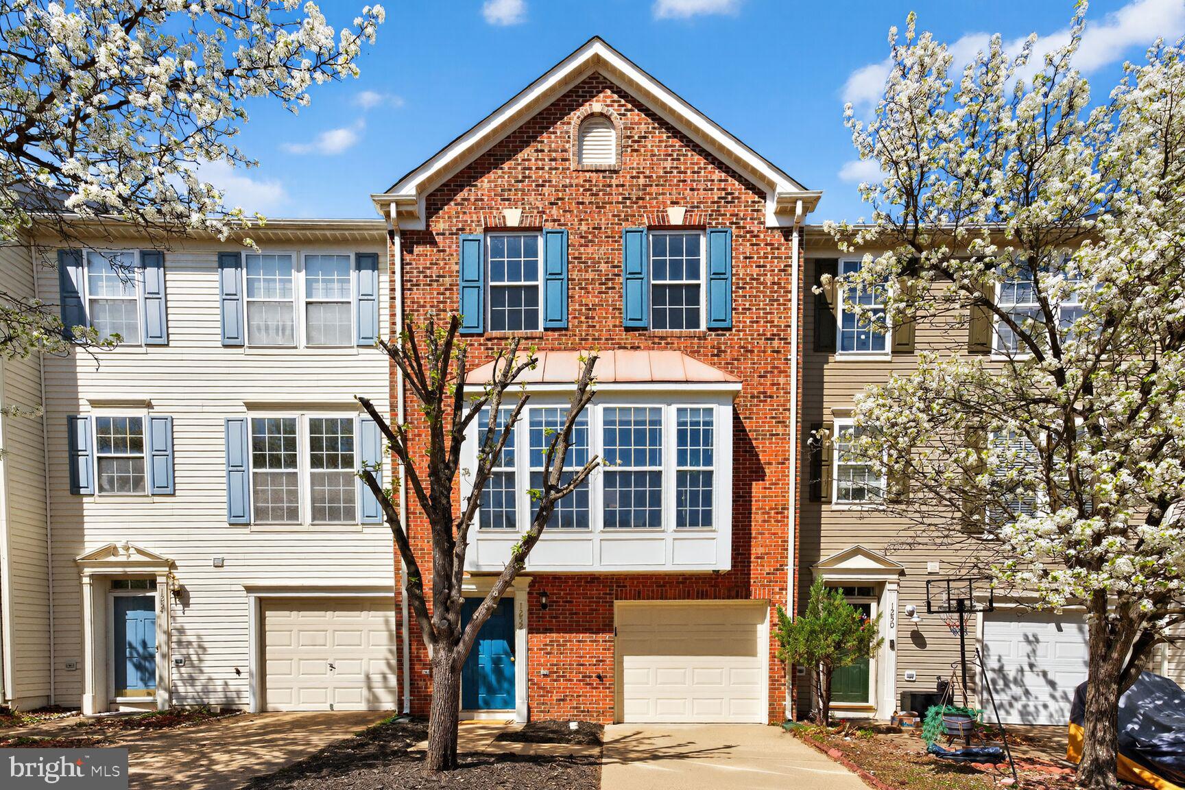 Welcome to 1252 Corbett Place, a rare Colonial brick townhouse with a COVETED GARAGE, on a charming, picture perfect street lined with Cherry Blossom trees!  This beautifully updated 3 Bedroom townhouse offers 2 Full Bathrooms, 1 Half Bathroom, and an inviting modern layout filled with natural light. Fresh paint, brand new plush carpeting, and thoughtful upgrades throughout create a warm and move-in-ready home. The Foyer features a vinyl entryway, a spacious coat closet, and a convenient Half Bath with new lighting and a new modern mirror.

The large, open Kitchen is designed for both cooking and gathering, with stunning granite countertops, stainless steel appliances, a deep undermount sink, and extensive cabinetry with on-trend hardware. Four nearly floor-to-ceiling windows fill the space with sunlight, while the kitchen island and adjacent Dining area make everyday meals and entertaining effortless. The Dining area / Breakfast Nook is a bright and cheerful place to start the day, featuring neutral tile flooring, new pendant lighting, and a new door that opens to the backyard for easy al fresco dining.

The open concept Living Room provides a spacious and comfortable setting for everyday living and hosting. Gorgeous hardwood floors, extended-height windows, and views of a Cherry Blossom-lined street make this space truly special. Upstairs, the Primary Bedroom offers a peaceful retreat with brand new carpeting, two sunny windows, and a custom walk-in closet complete with built-ins and chandelier lighting. The Primary Bathroom includes a large vanity with solid-surface countertop and a freshly reglazed tub and shower. Two additional Bedrooms, each with brand new plush carpet, abundant natural light, and fresh paint, share a full bathroom that has also been recently refreshed.

The lower level features a freshly painted Recreation Room with brand new carpet and overhead lighting, perfect for movie nights, game nights, or casual lounging. This Rec Room is great flex space, so get creative and turn it into a Play Room, Home Gym, Home Office, Music Room, or Arts & Crafts space.  Additional storage under the staircase keeps seasonal items neatly tucked away. A Half Bathroom, an enclosed Laundry Room, and interior access to the Garage add convenience to daily living. The Garage includes two heavy duty metal hanging racks and an electric opener.

Outdoor living is just as enjoyable, with a freshly re-stained deck, a private fenced yard, and plenty of space to relax, dine, or entertain. Whether enjoying your morning coffee or hosting a weekend cookout, this backyard oasis is ready for every season.

Residents of this vibrant community enjoy well-maintained common areas, a central playground, visitor parking, and included services such as trash, recycling, landscaping of common areas, and snow removal. The location is a commuter’s dream, offering quick access to I-95, Route 1, Route 123, the VRE, and nearby military bases. Minutes away, you can explore charming Occoquan, enjoy the outdoor beauty of Leesylvania State Park, Neabsco Boardwalk, regional parks, and countless trails and waterfront areas. Shopping and dining are abundant, with Potomac Mills, Stonebridge at Potomac Town Center, Wegmans, Costco, and numerous restaurants all close by.

Combining comfort, style, and unmatched convenience, this beautifully maintained townhouse is ready to welcome you home!