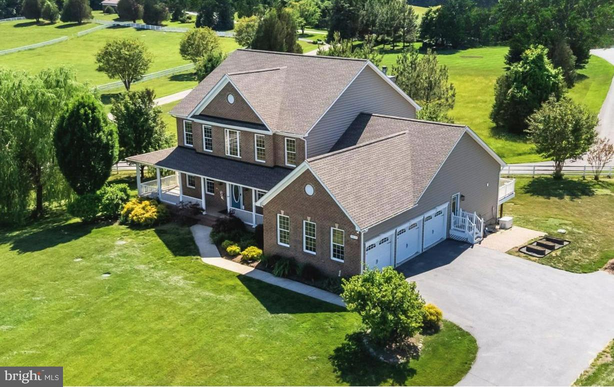 Find HOME in this spectacular 6,000-square-foot estate located in Timberneck, one of Northern Calvert's most sought after neighborhoods. With six extremely spacious bedrooms, each featuring an en-suite bathroom, 5 full and 1 half bathrooms, and an attached 3 car garage complete with EV Charging station, there's room for everyone! Enjoy this luxury kitchen, perfect for effortless entertaining or casual family meals, complete with oversized island, stainless appliances, a double oven, gas stove, and picturesque kitchen window overlooking lawn and neighboring pasture. The primary bedroom includes 2 large walk in closets  each with custom closet organization systems,  spa-like  primary bathroom with separate vanity/sink areas, a beautiful soaking tub, and luxury walk-in shower. Additional 2 upper floor bedrooms each feature en-suite full bathrooms and walk-in closets.  Main floor features 2  bedrooms (or offices) with connected jack and jill bathroom.  Fully finished walkout level basement contains nearly 2,000 sq ft of living space, with 2 large finished rooms - perfect as bedroom, office, or gym.  Lower level full bathroom with custom double vanity, and tile shower, and a large finished living space.  Loads of storage space throughout - a place for everything!  Upscale finishes and modern upgrades flow throughout this impressive layout, and  include a reliable whole-house generator and a convenient built-in EV charger, a new roof, and more.  The gorgeous exterior boasts mature trees spread on the perimeter of the lush  grassy lawn - easily maintained with the installed irrigation system, and perfectly situated for balance of sunlight throughout the day!  Perfect turnkey opportunity to move right in and enjoy luxury and HOME in Northern Calvert County!