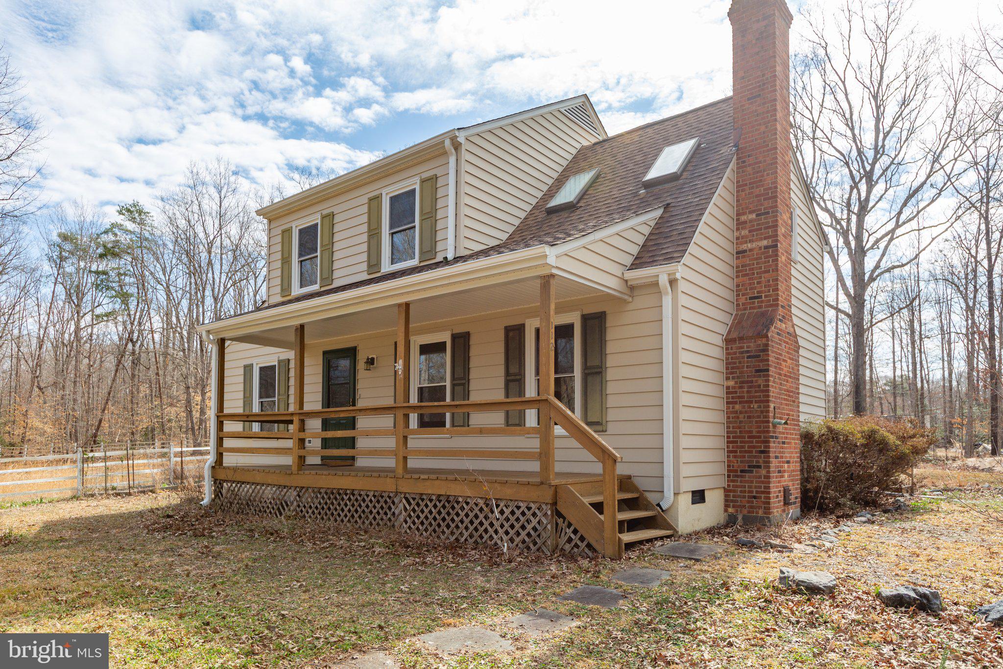 Turnkey home on 5.55 acres ready for its new owner. Have you dreamed of having your horse(s) at your property instead of hefty boarding fees? Ideal as a small horse farm where your sweat equity on the barn and outbuildings can really pay off.  Portions of fencing around the property are HTP 5” equestrian rail. 

Current owner has done numerous improvements over the last three years to include installing solar panels, Pella front door and rear French doors, gutters and downspouts, wood stove and chimney cap, distribution box on the septic, driveway culvert, 30 amp exterior receptacle, back yard patio with fire pit.  The Architectural shingle roof is 8 years old.  
Current owner teleworks and has AT&T and Verizon Fios already at the house with great reception.  The small cluster of homes are accessed thru the Woodfield Subdivision but are not part of it and are NOT  subject to any HOA.
There is a 21x11 Leonard building and a shed with a lean to close up to the house.  A short walk from the house will take you past the small solar panel field to a barn, tack shop and separate outbuilding.

The solar panels are owned and convey free and clear. Current electric bill with Dominion is ZERO!