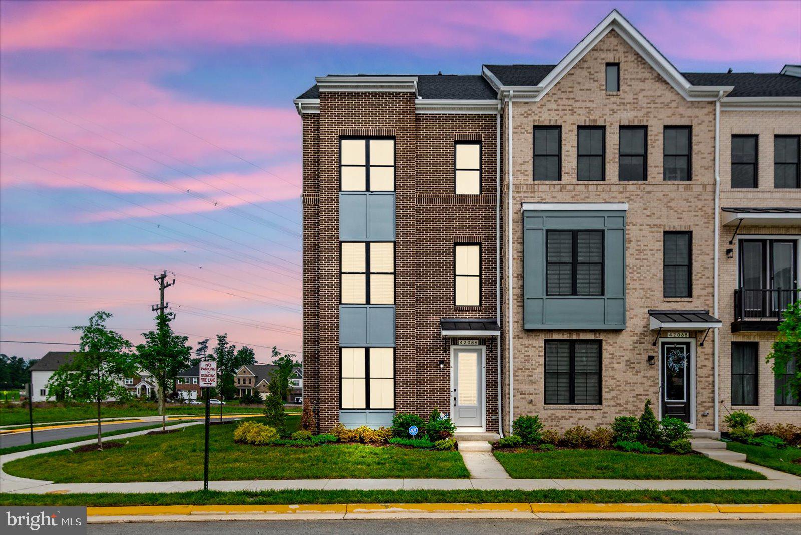 Built in 2025 by Van Metre Homes, this stunning Smith floorplan townhome at West Park III in the award-winning Brambleton community is the rare opportunity to own a brand-new home — without the new construction wait. Better yet, the builder's 12-month workmanship walkthrough is still available, giving the new owner full warranty coverage for interior finishes, surfaces, and systems. New construction protection, move-in ready.

Spanning four thoughtfully designed levels, this 3 bedroom, 2 full and 2 half bathroom home with a 2-car rear-entry garage delivers the space and flow today's buyers expect. The heart-of-the-home kitchen is a true standout, featuring a large island, quartz countertops, upgraded cabinetry, and stainless steel appliances — equally at home for weeknight dinners or weekend entertaining. Soaring 9-foot ceilings and luxury vinyl plank flooring set the tone throughout the main living level, while the spacious great room and dining area flow seamlessly together. Upstairs, the primary suite is a genuine retreat, complete with a generous walk-in closet and a spa-inspired bathroom with double sinks and an oversized frameless shower. Two additional bedrooms and a conveniently located upper-level laundry round out the upper floors.

The 2-car rear-entry garage keeps the streetscape clean and the curb appeal sharp — a detail that sets this home apart in the neighborhood.

The Community — Brambleton, Ashburn's Gold Standard

West Park III sits within the vibrant, master-planned community of Brambleton — a family-friendly neighborhood offering miles of trails, tot lots, parks, five community pools, over 18 miles of paved trails, sports courts, and close proximity to Brambleton Regional Golf Course. With Brambleton Town Center just down the street, residents enjoy walkable access to shopping, dining, a movie theater, and everyday conveniences. For commuters, West Park is minutes from Metro's Silver Line, Dulles International Airport, and key commuter routes including the Dulles Greenway and Toll Road — putting the entire D.C. metro area within easy reach.

Zoned for Madison's Trust Elementary, Brambleton Middle School, and Independence High School consistently among Loudoun County's most sought-after schools.

The Warranty Advantage — Don't Overlook This

Most buyers of new construction go through the builder's 12-month walkthrough themselves. Here, that window is still open for the new owner. Van Metre's warranty includes a one-year workmanship warranty on interior finishes and surfaces, a two-year systems warranty covering plumbing, electrical, and HVAC, and manufacturer warranties on appliances and equipment. This is builder accountability that transfers with the home — and it won't be available forever.