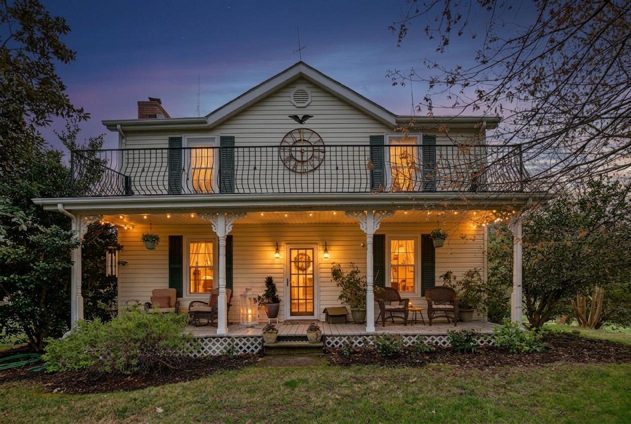 Experience timeless farmhouse charm in Mechanicsville...your story starts here.

If these walls could talk, they would whisper of cherished memories, home-cooked meals prepared with love, and celebrations shared with family and friends, including weddings once held on the grounds. This exceptionally maintained farmhouse is filled with warmth, character, and timeless appeal from the moment you step onto the sweeping front porch.

A unique upper balcony, adorned with handmade Italian-designed metal railings, offers peaceful views of the surrounding countryside. Inside, the heart of the home is an inviting eat-in chef’s kitchen featuring custom warm wood cabinetry with soft-close drawers, sleek granite countertops, and a 36-inch professional gas range...perfect for cooking and gathering.

The inviting living room showcases rustic exposed wood beams, a cozy fireplace with a wood-burning insert, and an original corner cabinet that anchors the home’s historic farmhouse charm. The spacious dining room easily accommodates a large table for holidays and special occasions. This move-in ready home offers 3 bedrooms and 1.5 updated bathrooms, blending classic style with modern comfort.

Beyond the main residence, the property offers exceptional versatility. A separate office or workshop is ideal for remote work, hobbies, or creative pursuits. Outdoor living is enhanced by a spacious wood deck with a beautiful pergola, along with multiple paved patios that provide endless options for relaxing or entertaining.

The impressive 32' x 60' barn with integrated powered garage and workshop space offers endless possibilities for storage, equipment, projects, or small farm use. Situated on 3.7 picturesque, unrestricted acres, the property also features an edible landscape with mature nut, fig, pear, and apple trees, creating a peaceful, park-like setting.

With no HOA and a whole-house generator, you’ll enjoy the ultimate freedom and peace of mind. Exceptionally maintained and ideally located in Mechanicsville, this isn’t just a home—it’s a lifestyle ready to welcome its next chapter.