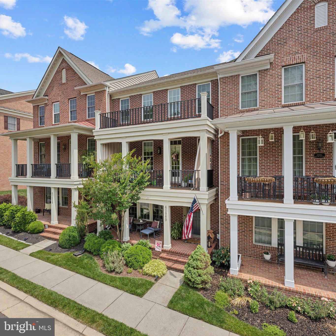 Welcome to this beautifully maintained brick townhome in the highly desirable Greene Mill Preserve, a vibrant community known for its year-round events and neighborhood feel. Residents enjoy a Fourth of July cookout and fireworks, spring egg hunt, outdoor movie nights on the green, visits from Santa each December, and a community center that's perfect for graduation parties, celebrations, and gatherings. The neighborhood also features a pool, walking trails, playgrounds, basketball court, butterfly garden, and preserved green space.

Offering over 2,400 square feet of stylish living space just minutes from Brambleton and Downtown Leesburg, this home features a rear-load two-car garage, Trex deck, two welcoming front porches, hardwood floors, a cozy fireplace, and an open-concept layout. The gourmet kitchen includes granite countertops, stainless steel appliances, a large center island, and designer backsplash. A private entry-level en suite bedroom provides the perfect space for guests, a home office, or multi-generational living. Upstairs, you'll find a spacious primary suite, two additional bedrooms, a full bath, and convenient upper-level laundry.

Conveniently located near shopping, dining, commuter routes, and top-rated schools. Home warranty included.