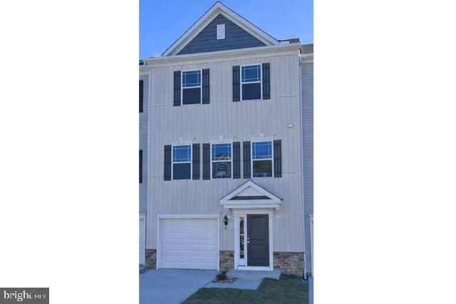 Beautifully three-story townhome offering space, comfort, and convenience. This home features 3 bedrooms and 2.5 bathrooms, along with a finished ground level that provides flexible space for a family room, office, or recreation area, plus an attached garage. The spacious eat-in kitchen includes a center island, perfect for casual dining, entertaining, or everyday living. Upstairs, the primary suite offers a private retreat with an en-suite bathroom and a generous walk-in closet. Ideally located near shopping, dining, and everyday conveniences, with quick access to Route 50, making commuting and travel a breeze.