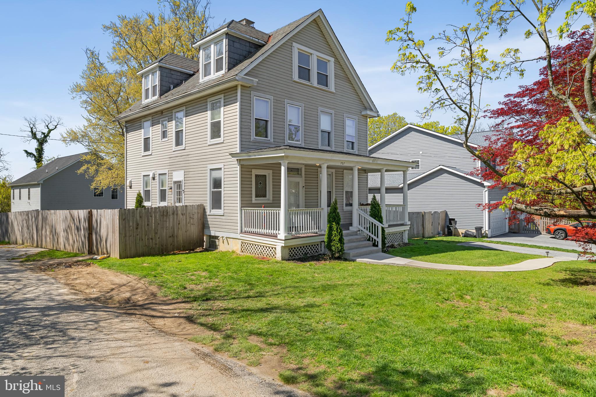 Range priced $560,000 to $575,000. Seller will accept or counter in the range. Step into timeless elegance with this stunning 5-bedroom, 3.5-bath porch-front Colonial, built in 1893 and beautifully updated for modern living. Spanning three spacious levels, this historic gem welcomes you with a grand entrance and an original wood staircase, setting the tone for the character and craftsmanship found throughout.

The home features 10' tall ceilings and expansive windows that bathe every room in natural light. A large living room offers the perfect space for relaxing or entertaining, while the spacious dining room—complete with an original fireplace—flows seamlessly off the kitchen. The kitchen itself is a chef’s dream, featuring a generous island ideal for hosting and gathering.

Upstairs, you'll find five large bedrooms and three updated bathrooms that blend comfort with style. Additional highlights include a refinished deck (2024), whole-house interior painting (2022), new refrigerator (2025), HVAC maintenance, and a professionally installed French drainage system with two new sump pumps (2022), offering both beauty and peace of mind.

Outside, enjoy a fully fenced backyard that is both spacious and private—perfect for outdoor living, play, or gardening. A private driveway with space for two vehicles adds rare and valuable convenience.

Located in a wonderful neighborhood with top-rated public schools, this exceptional home offers the perfect blend of historic charm and thoughtful modern updates. Don’t miss your chance to own a true architectural treasure.