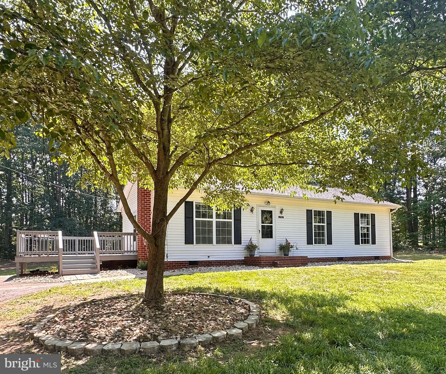 Welcome to 252 Evergreen Rd in Louisa!
You are going to LOVE this move-in ready, 3-bedroom, 2-full-bath ranch-style home situated on a picturesque 2-acre lot and zoned Agricultural! 
As you arrive, you'll appreciate the paved driveway, beautifully landscaped yard, mature plantings, and freshly painted deck that creates a warm welcome.

Notable Features & Updates Include:
✔ Energy-efficient vinyl windows
✔ Low-maintenance vinyl siding
✔ Trane HVAC (2018)
✔ New deck (2024)
✔ LVP flooring in the living room, dining room, and hallway (2024)
✔ Brand new Roof 6/25/2026

Step inside to the bright and inviting living room, featuring updated flooring and a lighted ceiling fan. The adjacent dining area flows seamlessly into the kitchen, which offers ample cabinet and counter space along with direct access to the oversized deck, perfect for entertaining or enjoying peaceful outdoor views.

The dedicated laundry room includes built-in shelving for added storage and organization.
The primary suite features a private ensuite full bathroom. Two additional bedrooms and a hallway full bathroom provide comfortable accommodations for family and guests.

Outside, the possibilities are endless! The expansive backyard offers wooded privacy, plenty of room for outdoor activities, and a cozy fire pit area that's perfect for gathering with friends and family on crisp fall evenings. 
A detached storage shed provides convenient space for lawn equipment and landscaping tools.

Conveniently located just 3 minutes from I-64, this property offers easy access to Charlottesville, Richmond, and surrounding areas, making commuting a breeze while still enjoying the peace and privacy of country living.

Don't miss your opportunity to own this beautiful home on 2 acres in Louisa County!