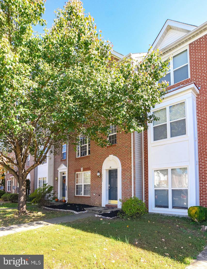 Spacious 3 level brick front  townhome in the perfect location with lots of community amenities! THREE LEVEL BUMP OUT....FROM THE LOWER LEVEL TO THE TOP LEVEL! Enter the lower level where there's a den/2nd family room, bonus room with slider to backyard, and a full bath.  Walk up to the middle/main level with open floor plan... Kitchen with gas range, island, dining area and plenty of counter space. Family room with bump out and  gas fireplace for those chilly winter days.  Gleaming hardwood throughout main level. Doors to deck overlook fenced in backyard.  Continue to the upper level featuring 3 bedrooms. Master suite with vaulted ceilings,  WIC,  and large master bath with double sinks, separate shower & soak tub. Community amenities gives you plenty of things to do.....pool for swimming on summer days,  play a game of tennis on the tennis courts, enjoy socializing at the clubhouse, long walks on the trails, or taking a trip to  either of the 2 playgrounds.  Located just  short drive to shopping, dining, restaurants, & more. Don't miss this one....schedule your appointment today!
