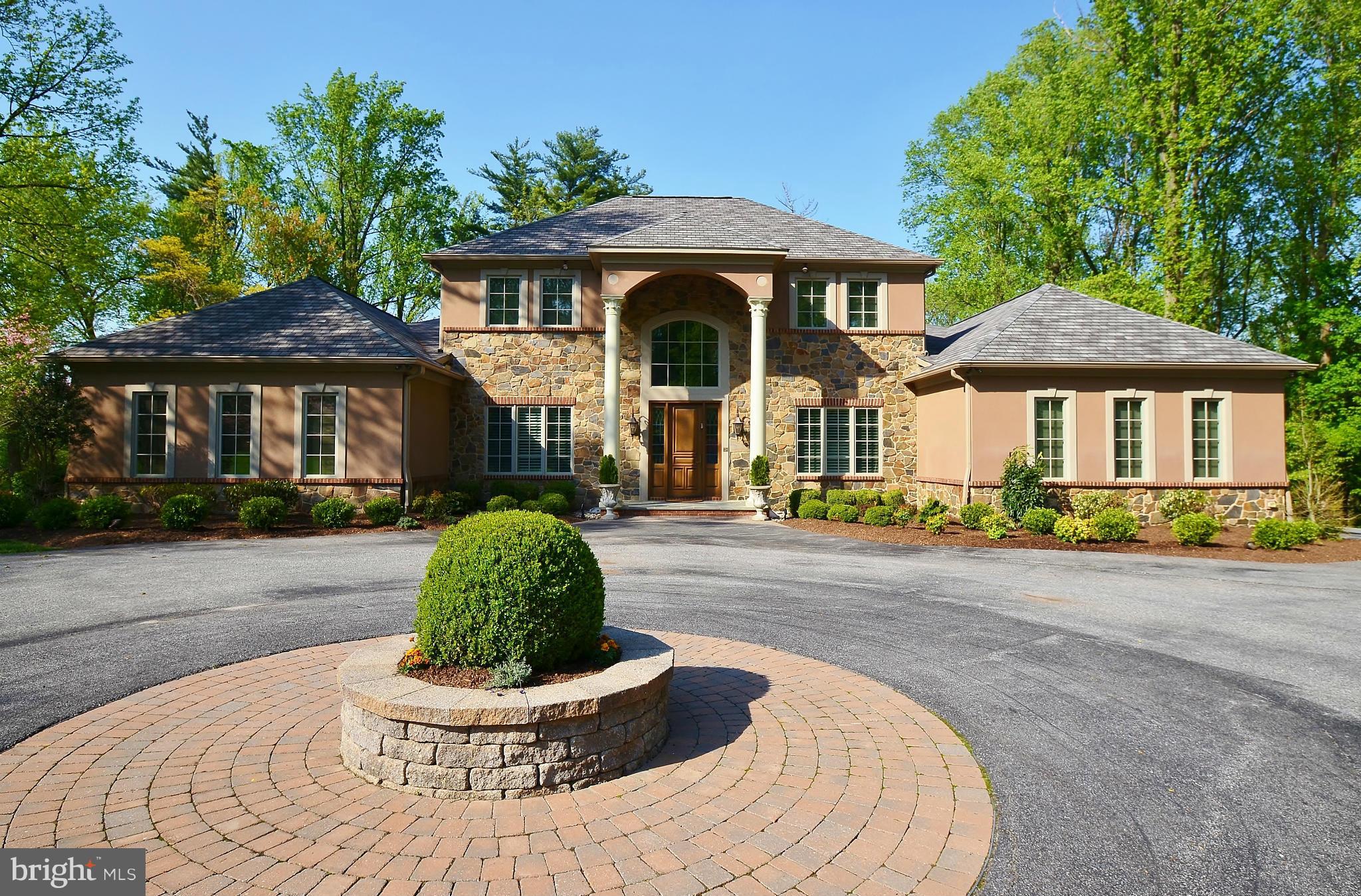 Extraordinary mediterranean style manse with beautifully executed traditional flair.  Klatsky built 6 year young 4 bedroom 5 bath with sensational kitchen, roomy family room and 1st floor master bedroom suite with double dressing areas.  3 bedrooms and 3 baths up and totally finished lower level.  Professionally landscaped private level lot.  CPOUFS.