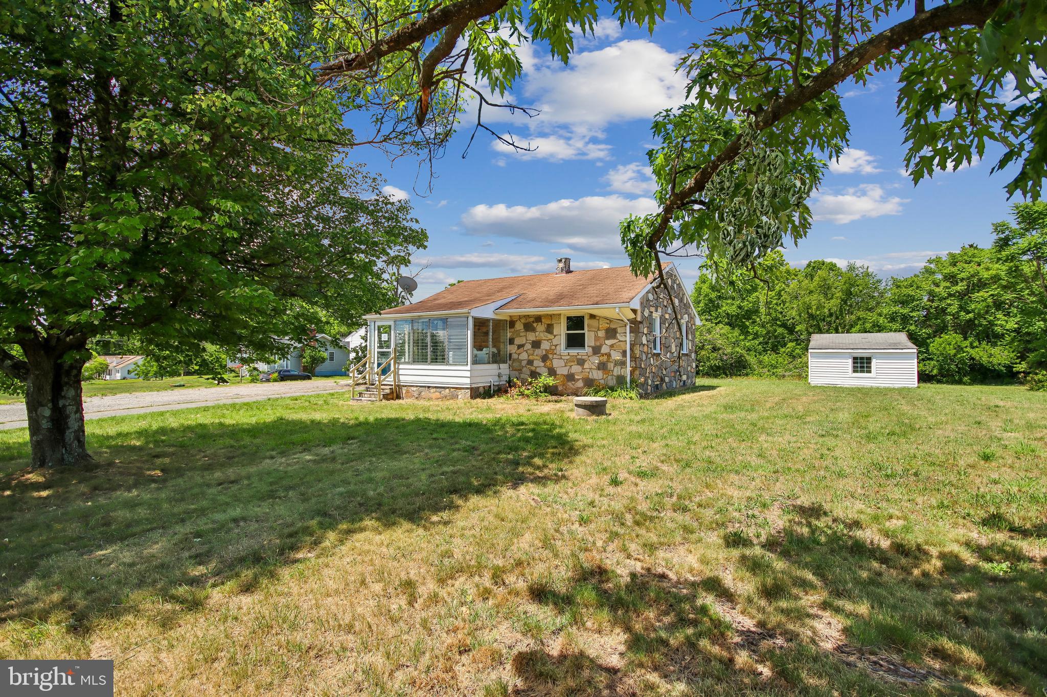 Location, location, location! We have found a charming stone home for you that offers an incredible opportunity for those seeking a cozy, character-filled place, situated in the sought-after area of Ferry Farm and White Oak areas. This charming home sits on nearly an acre of land. This property offers a peaceful and private retreat. This cozy home features two bedrooms and one full bathroom, providing a comfortable living space for a lucky individual or a small family. The beautiful hardwood flooring throughout adds a touch of warmth to your living space. This property also features a detached garage-workshop with a private office, complete with its own entrance. This separate space provides a perfect setting for those who work from home or desire a dedicated area for personal projects or crafts. This property sits on approximately 1 acre of land. The location of this home provides the perfect balance between privacy and tranquility. You can enjoy the benefits of a rural setting while being close to central amenities, including shopping centers, dining, entertainment, Dahlgren Naval Base, and I-95. This property was built prior to 1978. Lead-based paint potentially exists. This property may qualify for Seller-Financing (Vendee).