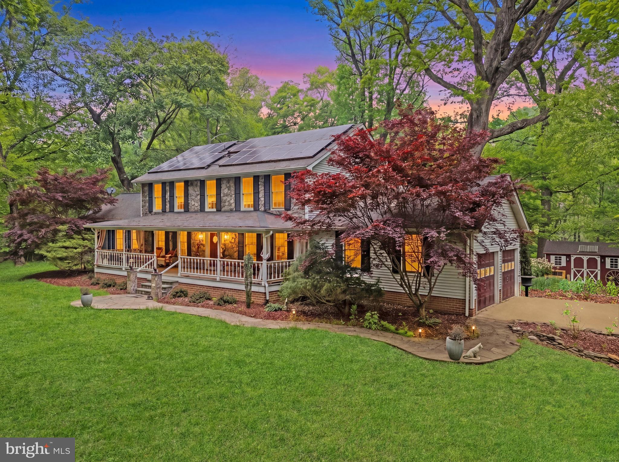 Your Western Loudoun escape awaits! 12080 Axline Road is a masterfully curated estate that captures the timeless essence of the English Countryside. Nestled within 5+ acres of National Wildlife Certified grounds, this 4-bedroom, 3-bath all-electric home (serviced by underground utilities) strikes a perfect harmony between artisanal craftsmanship and modern energy innovation.

The property is a location that strikes the perfect balance between country living and convenience. This is the ideal property for anyone seeking space to breathe, room to grow, and a home that truly feels like a retreat. Located in one of Loudoun County's most desirable rural corridors, this property provides the perfect blend of privacy and convenience, with easy access to local wineries, farms, town amenities, and major commuter routes.

The Heart of the Home: The interior reflects a commitment to bespoke luxury. The customized chef’s kitchen features a 48" KitchenAid built-in refrigerator, a Café double-oven range, with induction 5-burner cooktop, and specialized "Coffee" and "Breakfast" bars for effortless morning routines. At the home’s center, a sun-drenched breakfast room and hearth area—complete with a classic wood-burning fireplace—offer a cozy retreat overlooking the gardens.

Refined Living & Executive Spaces include:  The Library: A professional lower-level retreat featuring rich wood paneling, floor-to-ceiling bookshelves, and custom cabinetry. It opens to a tiled flex space, ideal for a hobby studio or mudroom.  The Great Room: Designed for quiet observation, with in-wall surround sound and expansive windows that frame "forestscape" views of nesting hawks and wildlife.  Primary Suite: A sanctuary of its own with a marble-top double vanity and a "His & Hers" closet configuration, including a massive custom-designed walk-in.

The grounds are a botanical masterpiece. From the handcrafted circle of reclaimed colonial-era bricks to the wide pea gravel walkways, every detail invites exploration. The rear of the property features a magnificent Potager garden—a French-style ornamental kitchen garden—with six sections arranged around a hexagonal center, perfect for organic vegetables, or take advantage of naturalized herbs like lavender and sage.

Modern Peace of Mind: While the aesthetic is timeless, the infrastructure is cutting-edge. The home is powered by a fully owned 8.52kW solar array and twin Tesla Powerwall 2 batteries, providing silent, comprehensive whole-home backup managed via mobile app.  System Ages: Kitchen Range (2023), Heat Pump (2022), Solar/Battery (2020), 30-Year Architectural Roof (2012), Back Deck (2017).

Meticulously cared for and move-in ready, this is a rare opportunity to own a standout estate in Loudoun County’s most desirable rural corridor. Be sure to view the two attachments with even more specific information: "Sanctuary of the Seasons - Ground and Outdoors", and "Property Features and Innovations."