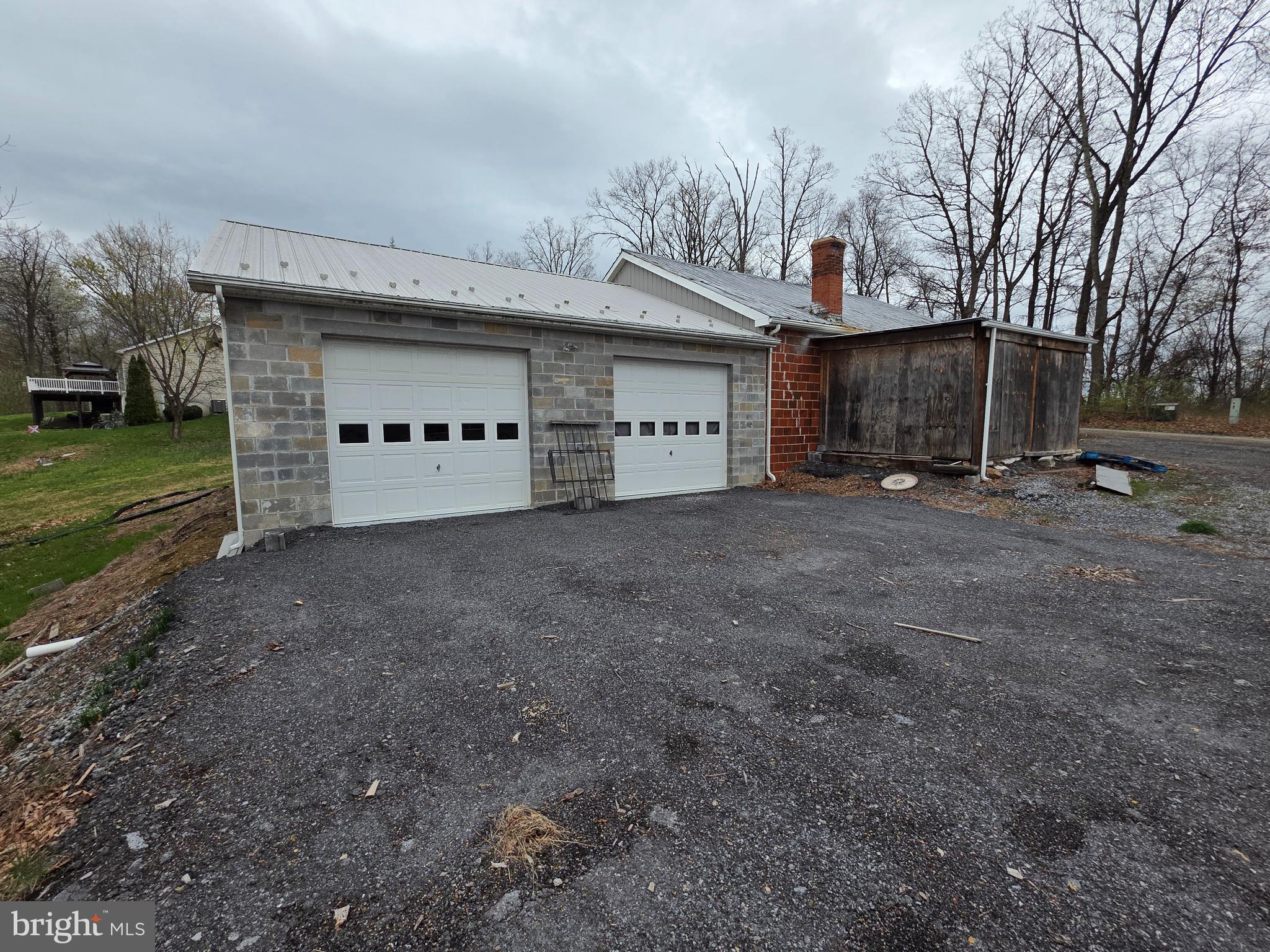 Rare opportunity to find unrestricted land in Hedgesville, just outside the Hedgesville City limits with no HOA. Parcel contains 3.4 +/- acres on Potato Hill st with a 36x75 building and views over looking the town of Hedgesville. All personal contents will be removed including storage container. The automotive lift may convey with full price offer. Buyer to pay transfer fees.