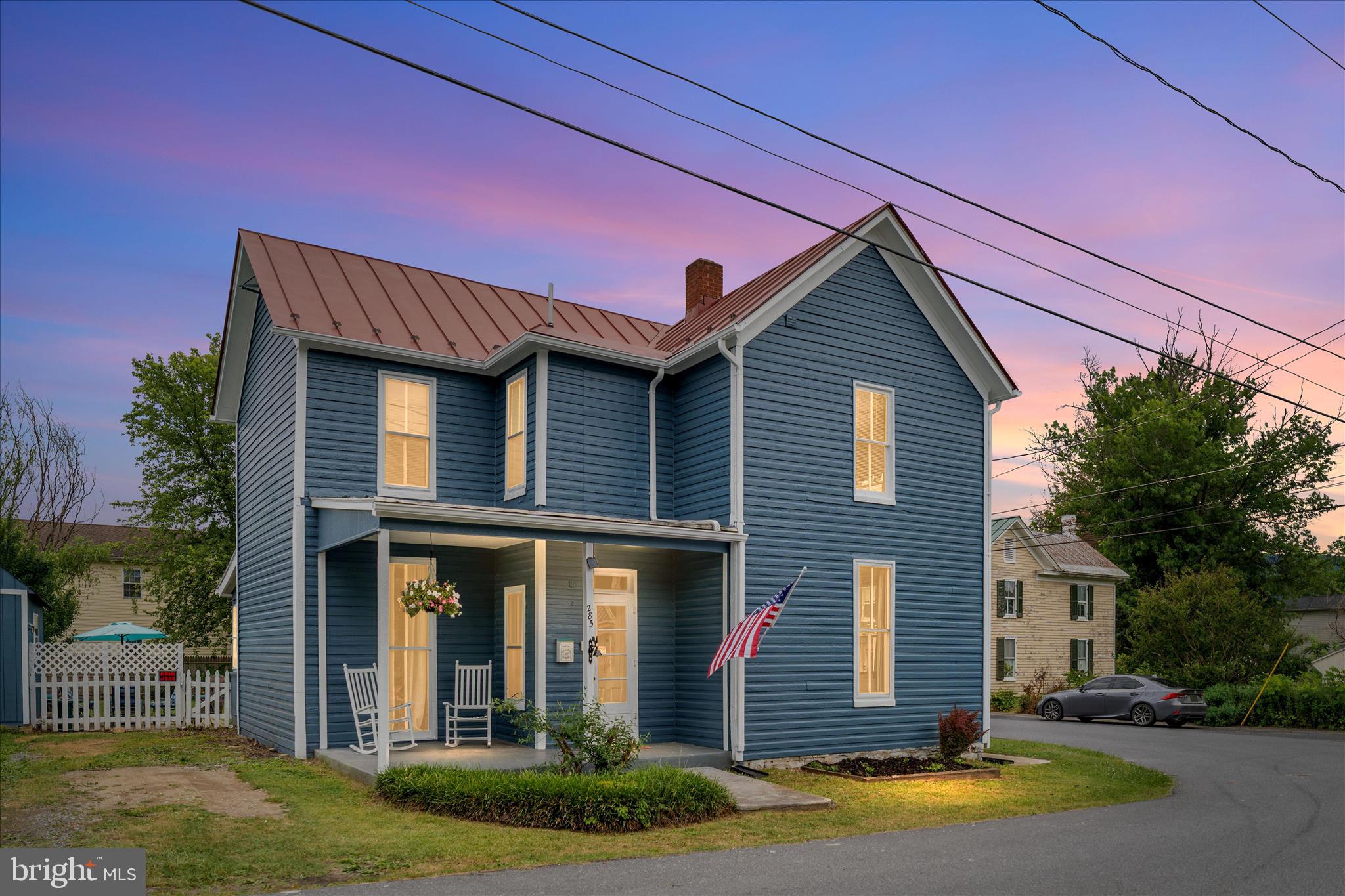 Welcome to 285 South Massanutten Street, a charming traditional farmhouse-style home offering 3 bedrooms, 1.5 baths, and a convenient location within walking distance to downtown Strasburg.

The exterior of the home has been freshly painted, giving it great curb appeal while maintaining its classic farmhouse character. Inside, the home features original hardwood floors that add warmth and charm. The layout offers comfortable living spaces, a formal dining room, and a large kitchen with lots of counter space. The full bathroom, located upstairs, has been fully remodeled.

Outdoor living is a major highlight, with a large backyard fully enclosed by a privacy fence, a patio area for relaxing or entertaining, and two storage sheds for extra space. The three-season back porch adds even more usable space and is perfect for morning coffee, gatherings, or simply enjoying the backyard setting.

The property also offers plenty of parking, with a large driveway for optimal off-street parking plus additional street parking available around the property.

With its farmhouse charm, freshly painted exterior, original hardwood floors, remodeled full bath, large private backyard, ample parking, and walkable location near downtown Strasburg, this home offers a great blend of character, convenience, and everyday functionality.