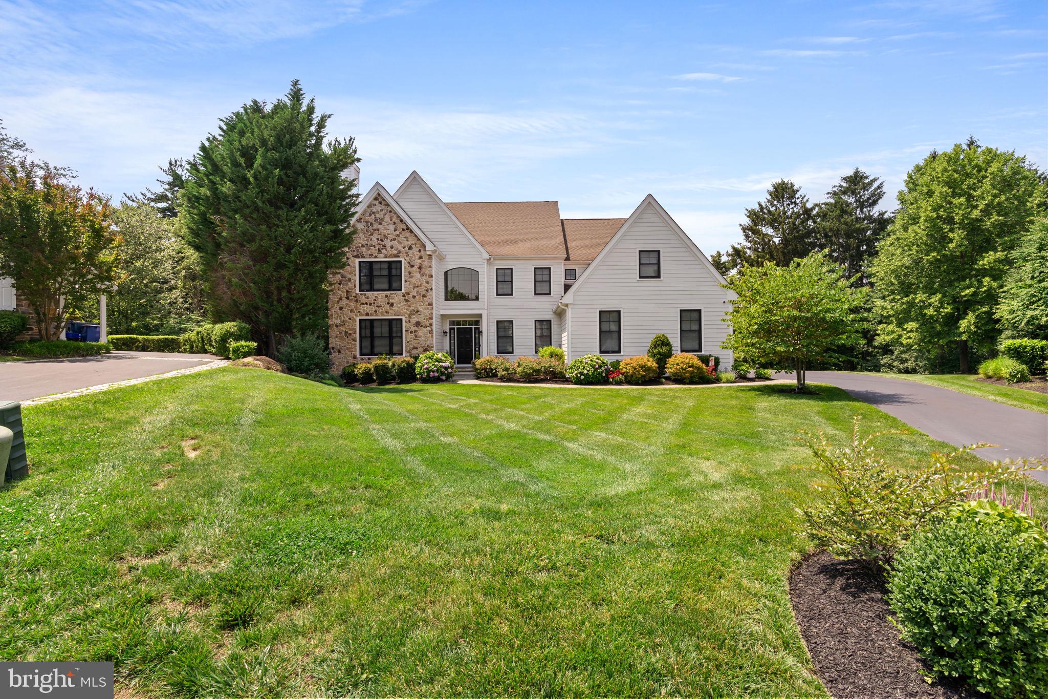 Welcome to 633 Edgewater Drive in West Chester, located in the highly coveted Edgewater community. This meticulously maintained home sits at the top of a quiet cul-de-sac, ensuring a peaceful and serene environment. With 6 bedrooms, 5 full/1 half baths, and nearly 6,000 square feet, this home offers luxurious space and exquisite finishes throughout. 

Step through the front door and you’re greeted by the main entrance which opens into a large cathedral ceiling foyer and open dining room with tray ceiling. The family room has an enormous two-story window which floods the first floor in sunlight. The recently remodeled, oversized kitchen has a two-sided fireplace into the family room, an eat-in space, and looks out onto a like-new covered deck overlooking the Fern Hill Reservoir, where it is common to see deer, red fox, and bald eagles. Off the kitchen sits a beautiful powder room, mudroom with laundry, and access to the three-car garage. Additionally on the first floor is a living room/bedroom suite with a gas fireplace and an ADA-compliant full bathroom with walk-in shower--perfectly suited for an in-law suite. A study and an airy sunroom complete the first floor. 

Traveling upstairs there are four bedrooms, including a large primary bedroom suite with dual walk-in closets, a dressing room with seating area, and a fully remodeled ensuite bathroom. The new ensuite bath includes all of today’s modern luxuries--a free standing soaking tub, dual head shower, double vanity, and radiant heated floors. 

Heading to the lower level of the home, you'll find a true walk-out basement with sliding doors to a private stone patio with fire pit. Custom built-in storage add to the functionality of the huge open entertainment area, along with a wet bar/micro kitchen—ideal for entertaining. The lower level also has a gorgeous full bathroom with walk-in shower and an additional bedroom which would be perfect for out of town guests or an au pair. Oversized windows allow ample light to flood the space. A separate mirrored exercise room complete the lower level.  

The exterior of the house has been updated with modern black windows, Hardie Board siding, established landscaping and thoughtful hardscaping throughout. The vaulted covered deck with a brick gas fireplace, ceiling fan, and heaters from above allow you to enjoy this space year-round. Hosting gatherings with your friends and loved ones will be an absolute pleasure with the built-in grill/kitchen. This home is one of the largest in the neighborhood and the location cannot be beat. Sitting just northeast of West Chester, across from the YMCA, near Chester County Hospital, and all of the wonderful shopping and dining downtown West Chester has to offer. To top it off, enjoy the award-winning West Chester School District. This home cannot be missed, all you need to do is unpack your bags. Schedule your tour today!