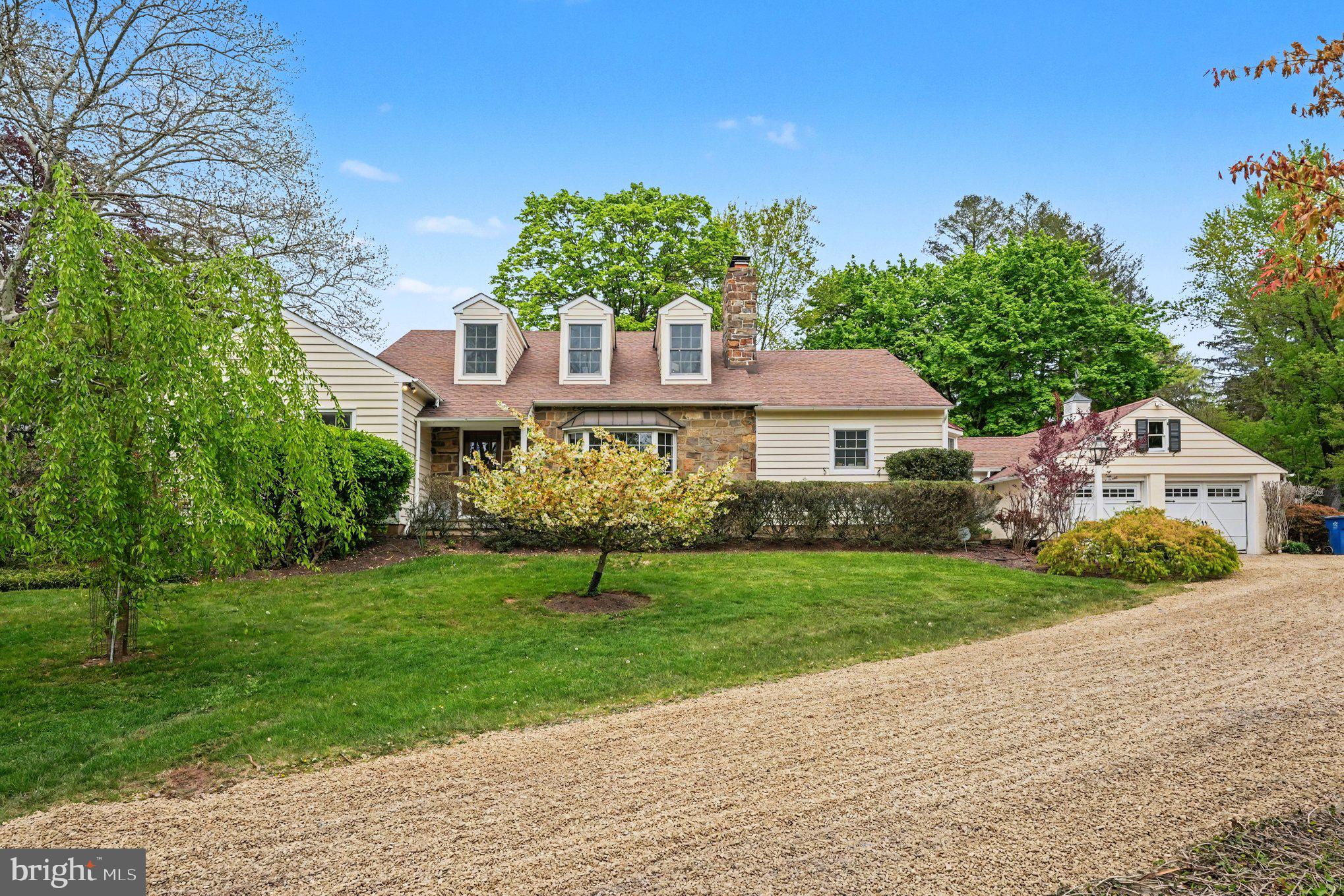 Welcome home to this magnificent custom-built residence nestled on 4.02 picturesque and bucolic acres. This stunning 4 Bedroom, 3.1 Bath renovated Cape Cod seamlessly blends timeless architectural charm with modern luxury, offering approx. 4,392 square feet of beautifully designed living space filled with natural light and exceptional craftsmanship throughout. Designed for both everyday comfort and elegant entertainment, the main level features a spacious Family Room with custom-built-ins, a large bay window, and a cozy wood-burning fireplace. The formal Dining Room showcases classic wainscoting, glass doors, and scenic views of the patio, while the inviting Living Room offers a custom bar and French doors leading outdoors — creating the perfect setting for gatherings both large and small. At the heart of the home is the expansive gourmet eat-in Kitchen, thoughtfully appointed with a large two-tier center island with bar seating and pendant lighting, a farm apron sink, top-of-the-line appliances, Sub-Zero refrigerator, a Lacanche/ Citeaux commercial-grade range with a plancha and warming oven alongside a main gas oven & accessory electric convention w/ exhaust hood, steam oven, subway tile backsplash, oversized pantry, and a sunlit breakfast area surrounded by walls of windows overlooking the property. Tucked privately off the Kitchen, the Home Office offers a peaceful workspace with serene backyard views. The luxurious first-floor Primary Suite serves as a private retreat featuring soaring vaulted ceilings, a walk-in closet, built-in dresser, and spa-inspired bath complete with a standalone soaking tub and oversized walk-in shower. An additional main-level en-suite bedroom — currently used as an office — offers flexibility for guests, au pair, or multigenerational living. A stylish Powder Room and spacious Laundry Room with utility sink and abundant shelving complete the first floor.  Upstairs, two generously sized bedrooms share a Jack-and-Jill bathroom with dual vanities and separate tub/shower area. The finished lower level provides incredible versatility with ample space for a media room, recreation area, home gym, workshop, and additional storage. Step outside to your own private sanctuary. The expansive patio, lush landscaping, mature apple and pear trees, fenced garden, and sprawling grounds create a peaceful setting ideal for relaxing, entertaining, and enjoying nature year-round. Offering exceptional space, flexibility, and privacy in a convenient location with easy access to major roadways — all within the highly sought-after Central Bucks School District — this relocation turn-key home is truly a rare offering. Schedule your private tour today!!