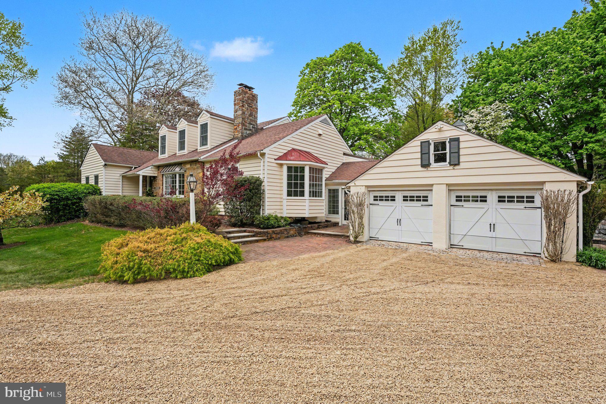 Welcome home to this magnificent custom-built residence nestled on 4.02 picturesque and bucolic acres. This stunning 4 Bedroom, 3.1 Bath renovated Cape Cod seamlessly blends timeless architectural charm with modern luxury, offering approx. 4,392 square feet of beautifully designed living space filled with natural light and exceptional craftsmanship throughout. Designed for both everyday comfort and elegant entertainment, the main level features a spacious Family Room with custom-built-ins, a large bay window, and a cozy wood-burning fireplace. The formal Dining Room showcases classic wainscoting, glass doors, and scenic views of the patio, while the inviting Living Room offers a custom bar and French doors leading outdoors — creating the perfect setting for gatherings both large and small. At the heart of the home is the expansive gourmet eat-in Kitchen, thoughtfully appointed with a large two-tier center island with bar seating and pendant lighting, a farm apron sink, top-of-the-line appliances, Sub-Zero refrigerator, a Lacanche/ Citeaux commercial-grade range with a plancha and warming oven alongside a main gas oven & accessory electric convention w/ exhaust hood, steam oven, subway tile backsplash, oversized pantry, and a sunlit breakfast area surrounded by walls of windows overlooking the property. Tucked privately off the Kitchen, the Home Office offers a peaceful workspace with serene backyard views. The luxurious first-floor Primary Suite serves as a private retreat featuring soaring vaulted ceilings, a walk-in closet, built-in dresser, and spa-inspired bath complete with a standalone soaking tub and oversized walk-in shower. An additional main-level en-suite bedroom — currently used as an office — offers flexibility for guests, au pair, or multigenerational living. A stylish Powder Room and spacious Laundry Room with utility sink and abundant shelving complete the first floor.  Upstairs, two generously sized bedrooms share a Jack-and-Jill bathroom with dual vanities and separate tub/shower area. The finished lower level provides incredible versatility with ample space for a media room, recreation area, home gym, workshop, and additional storage. Step outside to your own private sanctuary. The expansive patio, lush landscaping, mature apple and pear trees, fenced garden, and sprawling grounds create a peaceful setting ideal for relaxing, entertaining, and enjoying nature year-round. Offering exceptional space, flexibility, and privacy in a convenient location with easy access to major roadways — all within the highly sought-after Central Bucks School District — this relocation turn-key home is truly a rare offering. Schedule your private tour today!!