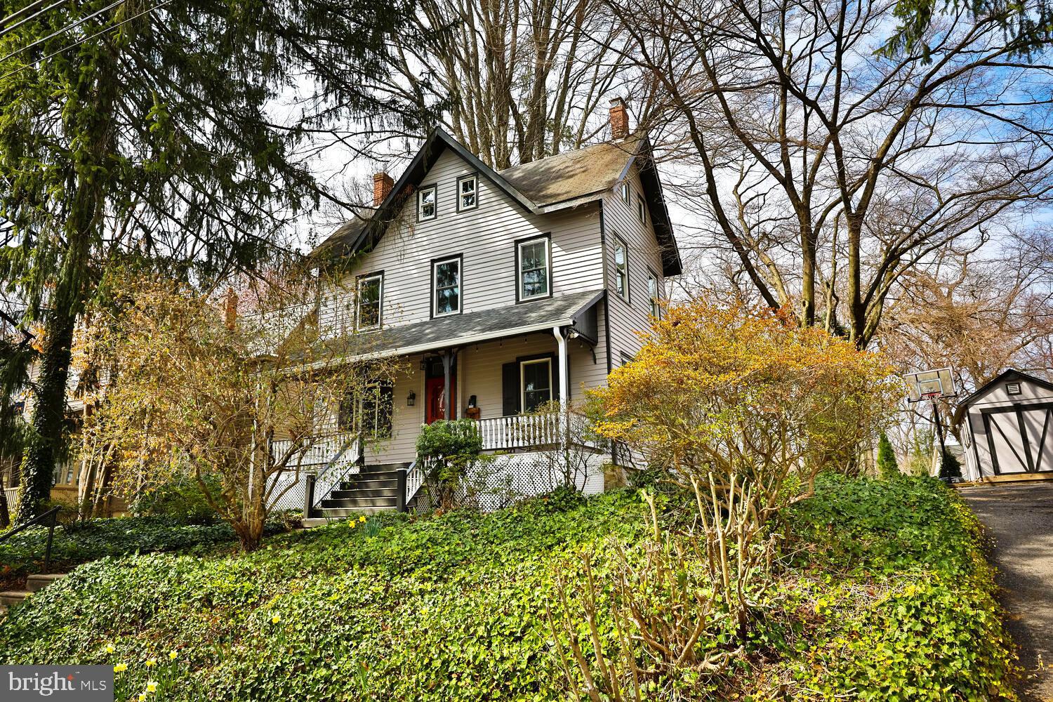 Welcome to Woodland Road, one of the prettiest streets in the historic neighborhood of Wyncote where unique and charming homes abound.  This three storied treasure sits high with a welcoming front porch and  transom front door.  The circular flow of the first floor will lead you from the entrance hall into the living room, which is presently being used as a music studio and then into the heart of the home, the kitchen.  This space beautifully combines old world charm with modern amenities.  White quartz countertops and slate tiled backsplashes  compliment the cabinetry and upgraded appliances; 5 burner gas range, under the counter beverage cooler, deep stainless steel sink with goose neck faucet, and an antique corner cabinet.  Adjacent to the kitchen is a large laundry/ powder room combination that includes a coat closet.  The comfortable family room with large game closet and sliders that exit to the lovely back yard, provides a cozy and inviting space.  The generous dining room with ample natural light from the large windows are graced with built in cabinetry.  Up the staircase you'll find a large flex space perfect for an office or second family room, along with a bedroom and hall bath featuring a claw foot tub.  The third floor offers two additional rooms and a large full bath with stall shower, sky light and two  double closets. 
 Additional updates include first floor hardwoods, new windows throughout and upgraded electric service (no Knob & Tube!).    Located a short walk to the Jenkintown Train station and the popular Thomas William Park, local shops and a convenient drive to Center City, this home offers charm and convenience.