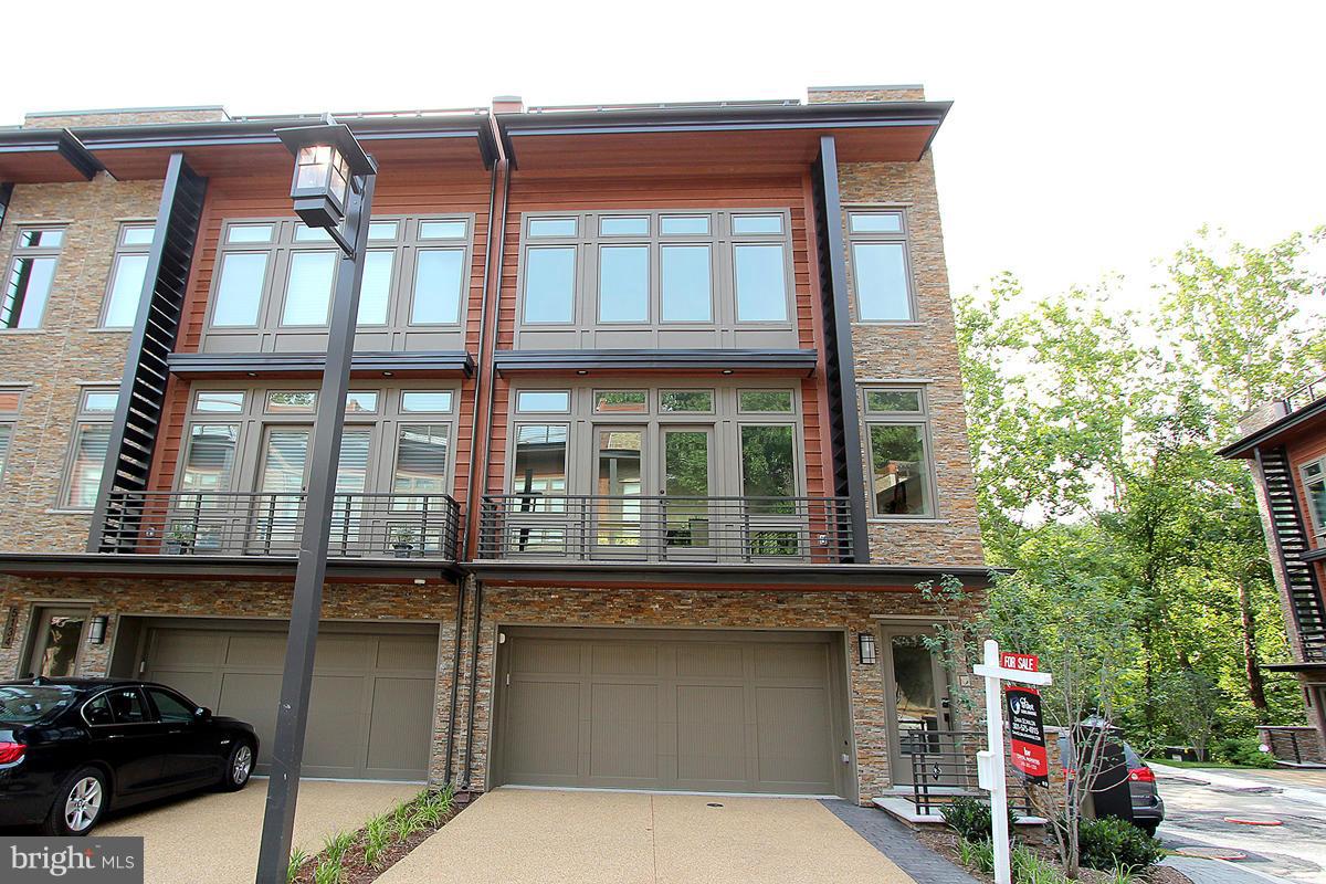 New price!Stunning new end unit with over $100k upgrades. LEED Standard, floor to ceiling windows, soaring 9'6" ceilings, elevator, open floor plan w gourmet kitchen to die for. Roof top terrace in the trees w built in Viking grill, retractable awning, hot tub rough in, romantic FP. Home technology package.Turnkey lifestyle. Access to Capital Crescent Trail & close to all of Bethesda. SUN 2-4