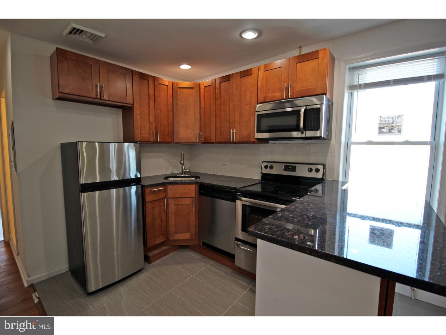 This apartment is has been outfitted with luxury finishes and original refinished hardwood floors. Both bedrooms are spacious and on opposite sides of the apartment. The bathroom, living room, and kitchen are in between the bedrooms, making it a very nice layout for roommates.  This is an awesome location! Very close to the "El" train, trolleys, and other public transportation. The Spruce Hills pocket of University City/West Philly is just steps to local cafe's, pubs and restaurants. Neighborhood favorites include the Green Line Cafe, Local 44, and Honest Toms Tacos.