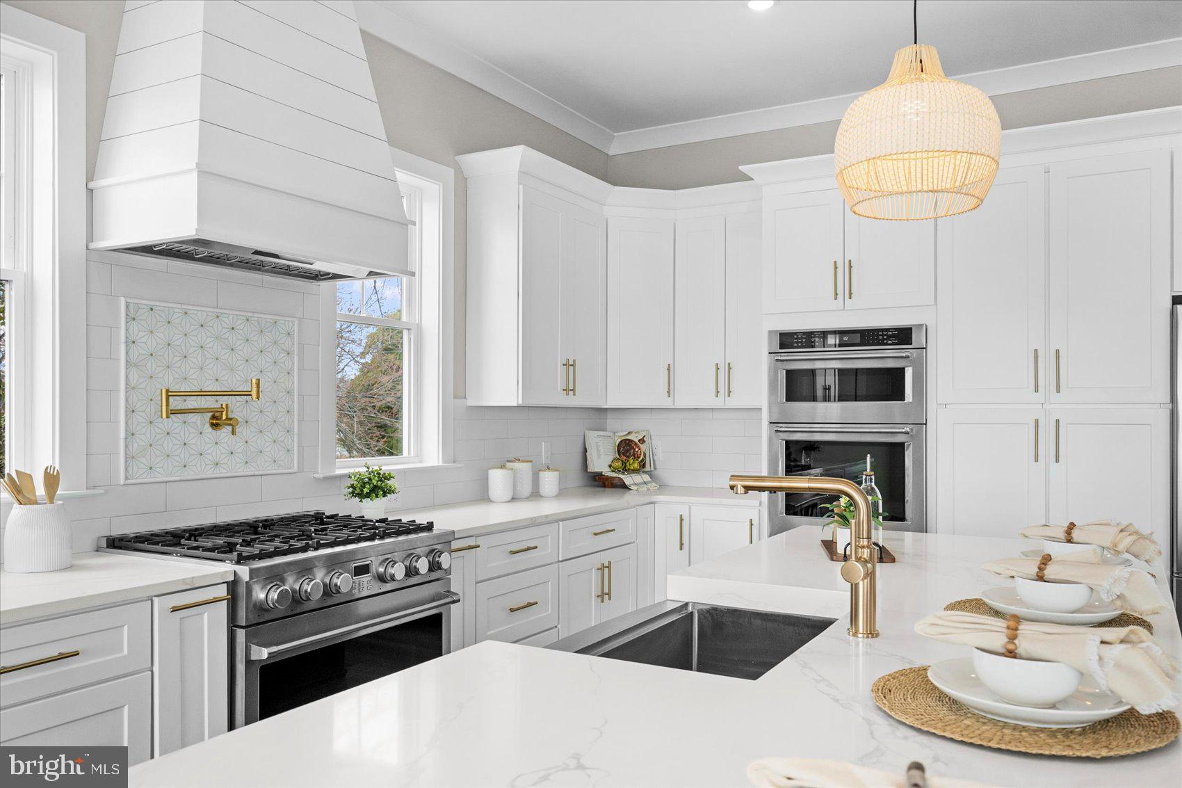 New construction home offering an open and versatile floor plan with 10 ft ceilings on the main level and walls of windows that capture panoramic, unobstructed views of the Chesapeake Bay and Bay Bridge. **Seller will provide driveway credit at closing so buyer can choose the style** The Bayfront primary suite includes a private walk-out balcony on the double-decker deck, a tray ceiling, oversized walk-in closet, and a spacious spa-inspired bath with waterfront views. This home features 5 bedrooms and 2.5 baths, including a main-level office/guest room that can serve as the 5th bedroom. The kitchen is designed for entertaining, with a 36" gas range, 42" cabinets, large center island, double wall oven/microwave combo, and a huge HIDDEN walk-in pantry providing exceptional storage.
Additional highlights include: Wide open main level floor plan with multiple sliding doors and expansive windows Double-decker decks with sweeping Bayfront views Luxury finishes throughout
Prime location on Millers Island, close to local dining, waterfront bars, and recreational amenities
Enjoy luxury waterfront living with unmatched views and modern design in a sought-after community.