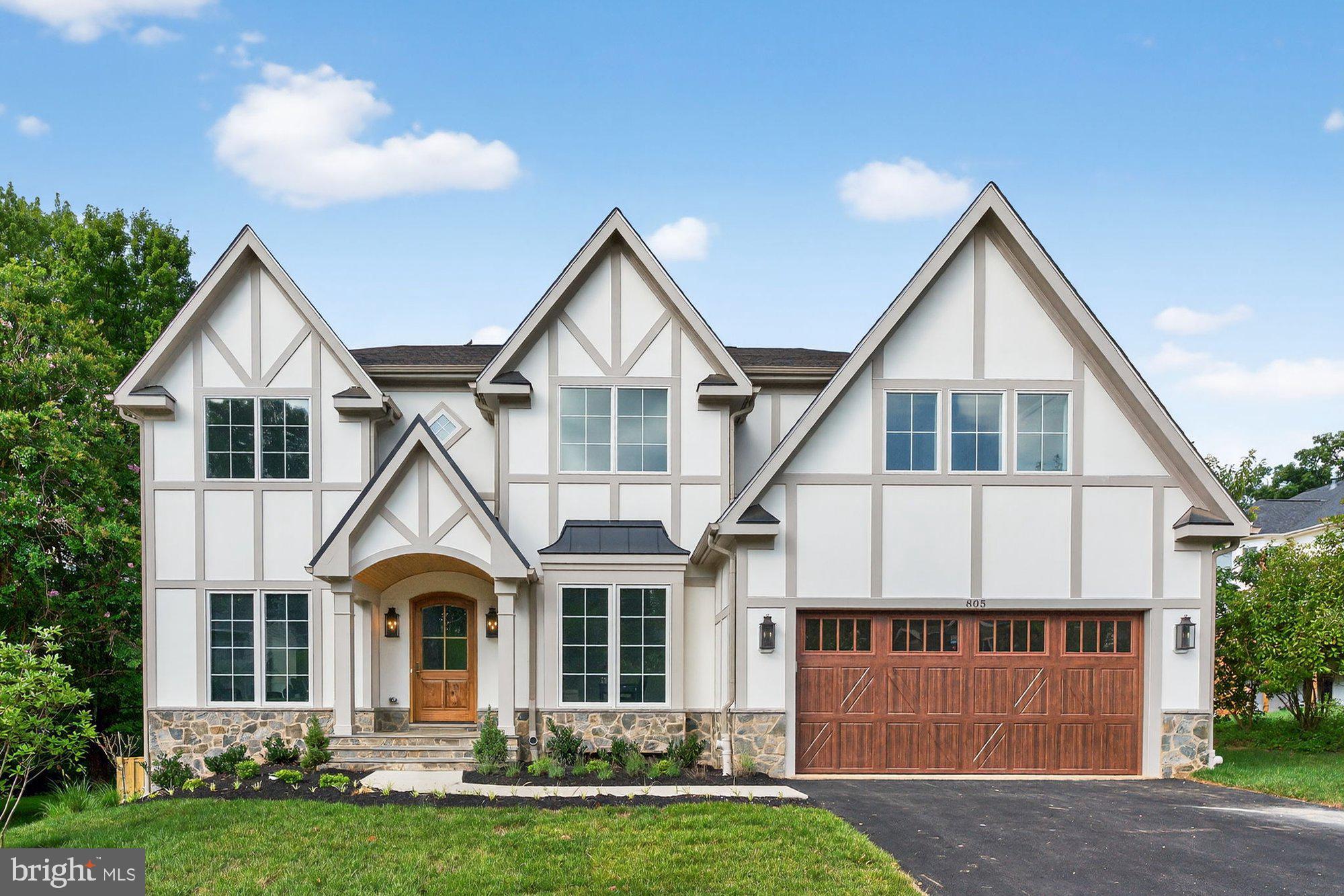 ***JUNE 2026 DELIVERY***

Sekas Homes presents a stunning new construction residence in the Belmont, offering over 6,800 square feet across three finished levels with 6 bedrooms and 6.5 bathrooms. Thoughtfully enhanced with high-end upgrades and designer finishes throughout, this home blends timeless elegance with modern functionality.
The main level features 10’ ceilings, formal living and dining spaces, a private office, and a main-level guest suite, all anchored by a gourmet kitchen showcasing JennAir appliances, quartz countertops with full-height backsplash, upgraded cabinetry, custom hood with brass detailing, beverage center, and extensive lighting upgrades. The kitchen flows seamlessly into the family room, highlighted by a Cosmo linear fireplace with passive heat, cedar-wrapped beams, and custom trim details. Upstairs, the owner’s suite offers a luxurious retreat with custom wall trim, upgraded closet systems, LED backlit mirrors, and a curbless, tile-to-ceiling shower with frameless glass and linear drain. Secondary baths include upgraded tile selections, niches, and quartz countertops throughout. The fully finished lower level is designed for entertaining and flexibility, featuring a recreation room, exercise room, additional bedroom and bath, wet bar, and a custom wine cellar with acrylic racking, accent tile, and WhisperKOOL cooling system. Indoor-outdoor living is elevated with a screened porch and Trex deck featuring a TV wall, heater prewiring, gas line, and audio connections, complemented by a slate front walkway, fenced rear yard, and keyless entry. A 4-foot garage extension enhances the oversized 2-car garage. Additional highlights include wide-plank hardwood flooring throughout main and upper levels, oak stair treads, upgraded interior doors, whole-home audio prewiring, enhanced electrical and lighting packages, sump pump battery backup, and upgraded plumbing fixtures and sinks. Set in a prime McLean location, this home delivers exceptional craftsmanship, elevated design, and luxury living at every turn.


***List price subject to change based on builder's change order*** *Front elevation and interiors used from previous listing* .