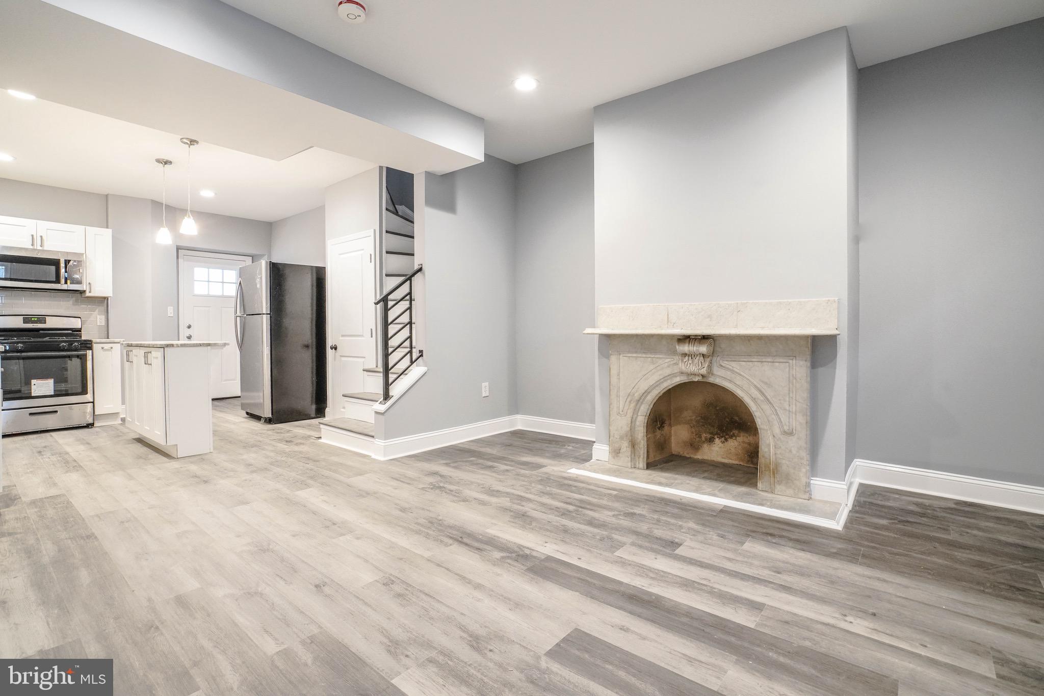 We cordially welcome you to see 4350 Cresson Street - a complete renovation one block off of Main Street in the ever popular section of Manayunk! A beautifully sculpted and smoothed facade with matching window trim and paint welcome you as you approach the property. This 1,600 square foot residence has been updated with new hardwood floors and a complimented paint job throughout. Enter into a quaint living room space featuring a prominent decorated mantle. Segway through into the formal kitchen and dining area complete with the latest and brightest amenities out today! The kitchen boasts a new backsplash featuring subway tiling, gorgeous granite countertops throughout, including the island for added space. White shaker cabinets and a stainless steel appliance package complete this area! Off the end of the kitchen is access to and from the covered rear patio and oversized back yard. Upstairs find four generously sized bedrooms each offering ample space for stretching and moving in all of your belongings. Accompanying these bedrooms are two full bathroom featuring new vanities and subway tiling throughout. Luxurious finishes can be seen in every inch of this property! Off of the rear of the home on this second level is a deck - ideal for entertaining and enjoying the nightlife that Manayunk is all about! Downstairs in the lower level of the home is a partially finished basement for storage and additional living space. This townhome is pin pointed right in the center of all the action - a stone skip from the infamous Insomnia Cookies, Winnie s, Taqueria Feliz, and all the views along the Schuylkill River.