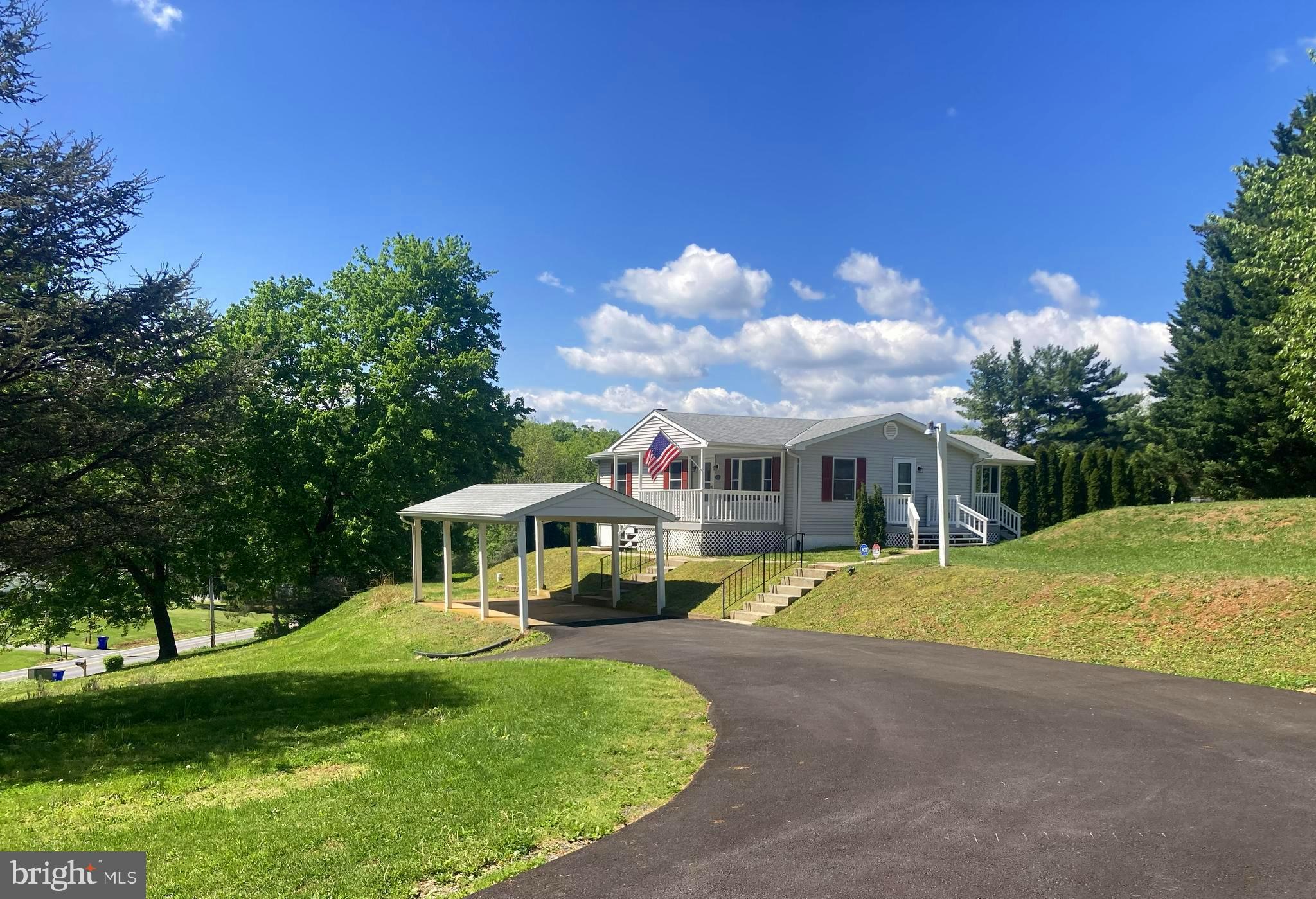 Move-in ready - no weekend projects or immediate capital improvements needed!   100% USDA financing available (subject to income limits).   Recently updated 3 bedroom 2 full bath raised ranch on .92 acre very private lot with massive off street parking for 10+ personal or work vehicles with no HOA fees or restrictions.   Detached carport and HUGE (750+ sq. ft.) detached garage/workshop with 12' ceiling height and 10' x 10' roll-up door.   Detached garage/workshop has new roof, gutters and downspouts, siding, windows, shutters, and pedestrian door.   Sale also includes a 200+ square foot storage unit adjacent to the garage with 7 foot ceiling height.  Detached carport with new roof.   In addition to the 3  bedrooms on the first level, the lower level has two additional bonus rooms with closets.  Englander woodstove in the family room.   New kitchen appliances, freshly painted inside and outside, new  carpet,  new radon remediation system, new smoke detectors, new electric baseboard heaters on lower level, new asphalt driveway, new well pressure tank in 2025, new water line installed from well to home in 2025, new water heater in 2023,  new Carrier A/C system in 2021,   & much more!  Outstanding value for an improved property in pristine condition on Kemptown Church Road (priced well below the  current replacement cost of the land and the improvements)!  Two nearby vacant lots of similar size (just under 1 acre) located on Kemptown Church Road are currently for listed for sale at $295,000 and $315,000  respectively.  Close to Kemptown Park.  Listing agent/broker is the co-owner of the property.  Come see for yourself at the OPEN HOUSE this Sunday, June 7th  between 1 pm and 4 pm!