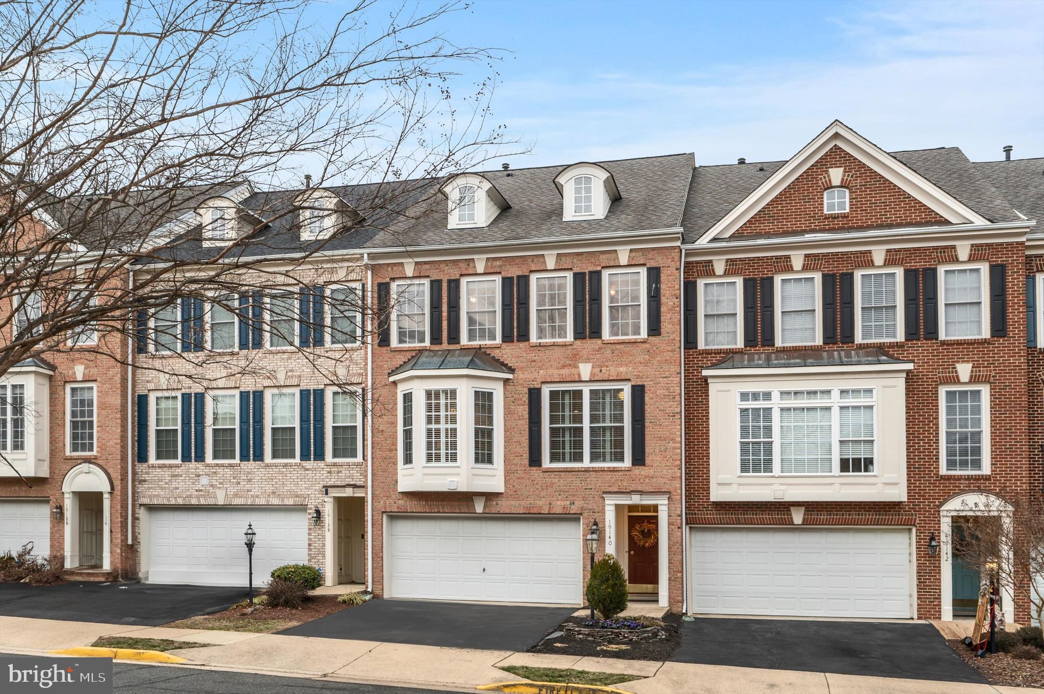 This charming townhouse in Lansdowne on the Potomac features an inviting layout with three bedrooms and two full baths, complemented by two half baths for added convenience. The main level showcases beautiful hardwood floors, enhancing the home’s elegance and warmth.  Crown molding detail is found throughout the main level for added elegance. The living room is a highlight, adorned with stunning palladium windows that flood the space with natural light, creating a bright and airy atmosphere. The eat-in kitchen is designed for both functionality and style, equipped with stainless steel appliances and a large island, perfect for meal preparation and casual dining.  The primary ensuite bedroom boasts hardwood flooring along with an ensuite bathroom complete with soaking tub and a separate frameless walk-in shower.  Step outside to enjoy the deck and patio, ideal for entertaining or relaxing while taking in the serene surroundings.  The community center,  Potomac Club, provides a variety of fitness and lifestyle amenities which include inside/outdoor pools, billiard/game room, fitness center, party room, beach volleyball court, etc. This townhouse combines modern amenities with a comfortable living environment, making it a perfect choice for anyone seeking a vibrant community lifestyle.