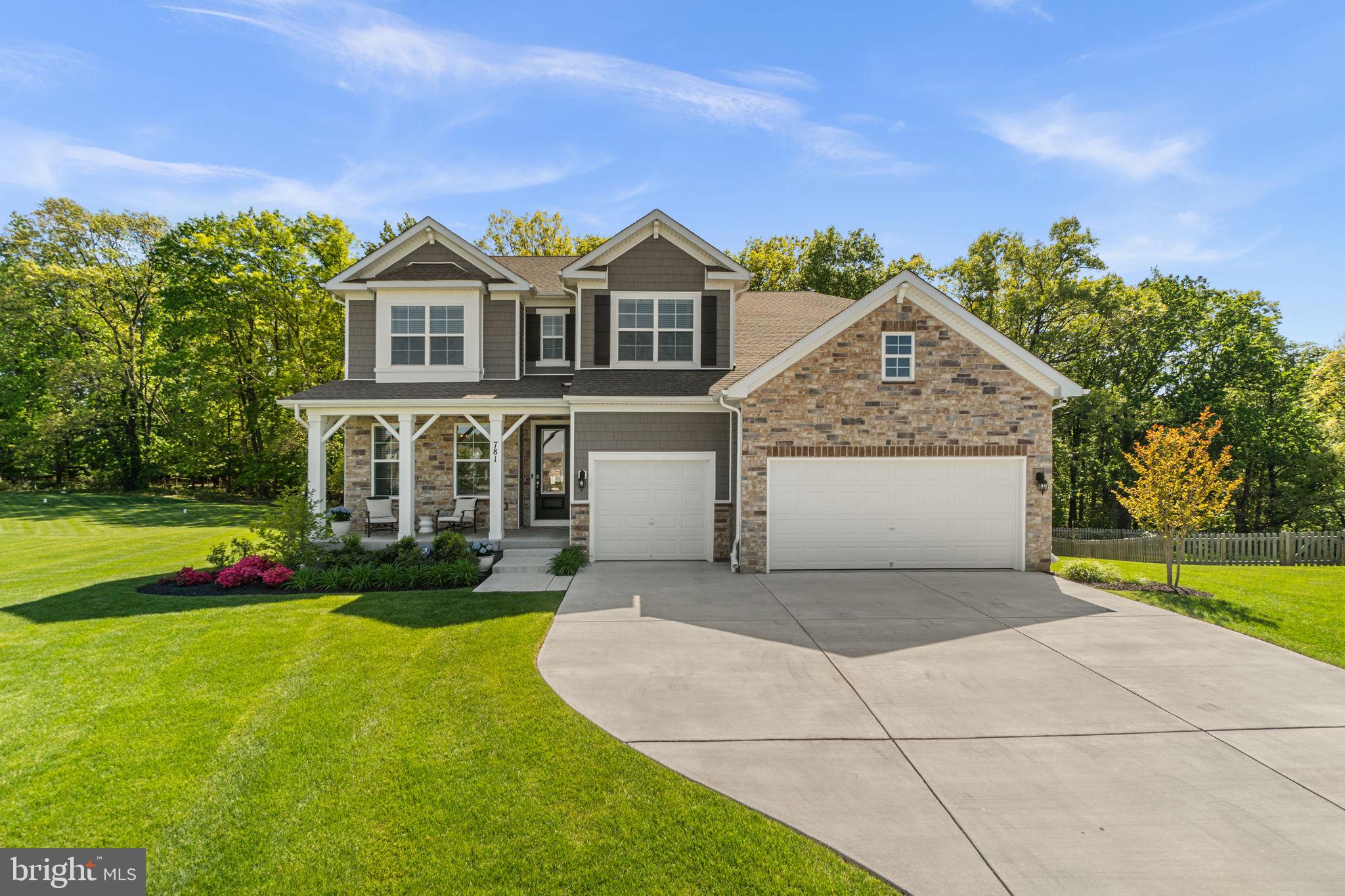 Featuring over 4,400 square feet of beautifully finished living space, this impeccably maintained 6-bedroom, 4-bath home is perfectly positioned on a premium lot at the end of a quiet cul-de-sac in the highly desirable Stonegate Community—offering added privacy, scenic views, and an exceptional setting.

A welcoming front porch invites you inside, where a versatile flex room just off the entry provides the perfect space for formal dining, a sitting room, or a home office. This area connects seamlessly to the kitchen space through a butler’s pantry and walk-in pantry—ideal for a stylish coffee nook with ample additional storage.
The open-concept gourmet kitchen is the heart of the home, featuring a generous island designed for gathering and entertaining, and flows effortlessly into the sun-filled family room with expansive windows that flood the space with natural light. The kitchen is further enhanced by a reverse osmosis water filtration system. Continue outside to the upgraded screened-in porch, which showcases lofted ceilings and low-maintenance Trex decking—an inviting retreat to relax and take in serene sunset views.

A private hallway off the family room leads to a main-level bedroom, full bath, coat closet, and access to the three-car garage—perfect for guests, multi-generational living, or a secluded workspace.
Upstairs, a hardwood staircase leads to the luxurious primary suite, highlighted by an elegant tray ceiling and a spa-inspired bath with a double vanity, soaking tub, frameless glass shower, and two expansive walk-in closets. The upper level also features three spacious secondary bedrooms, a well-appointed full bath with a separate toilet and shower area, a generous loft/flex space, and a convenient laundry room complete with a top-of-the-line Speed Queen washer and dryer.

The finished basement expands your living space even further, offering a large recreation room, sixth bedroom, and full bath—perfect for entertaining or extended stays. The mechanical room includes built-in storage and an active radon mitigation system for added peace of mind. Sliding glass doors lead to a covered stamped concrete patio, seamlessly blending indoor and outdoor living.

Positioned in one of the most desirable locations in the community, this home offers the ideal blend of space, comfort, and thoughtful upgrades. Schedule your private tour and see what sets it apart.