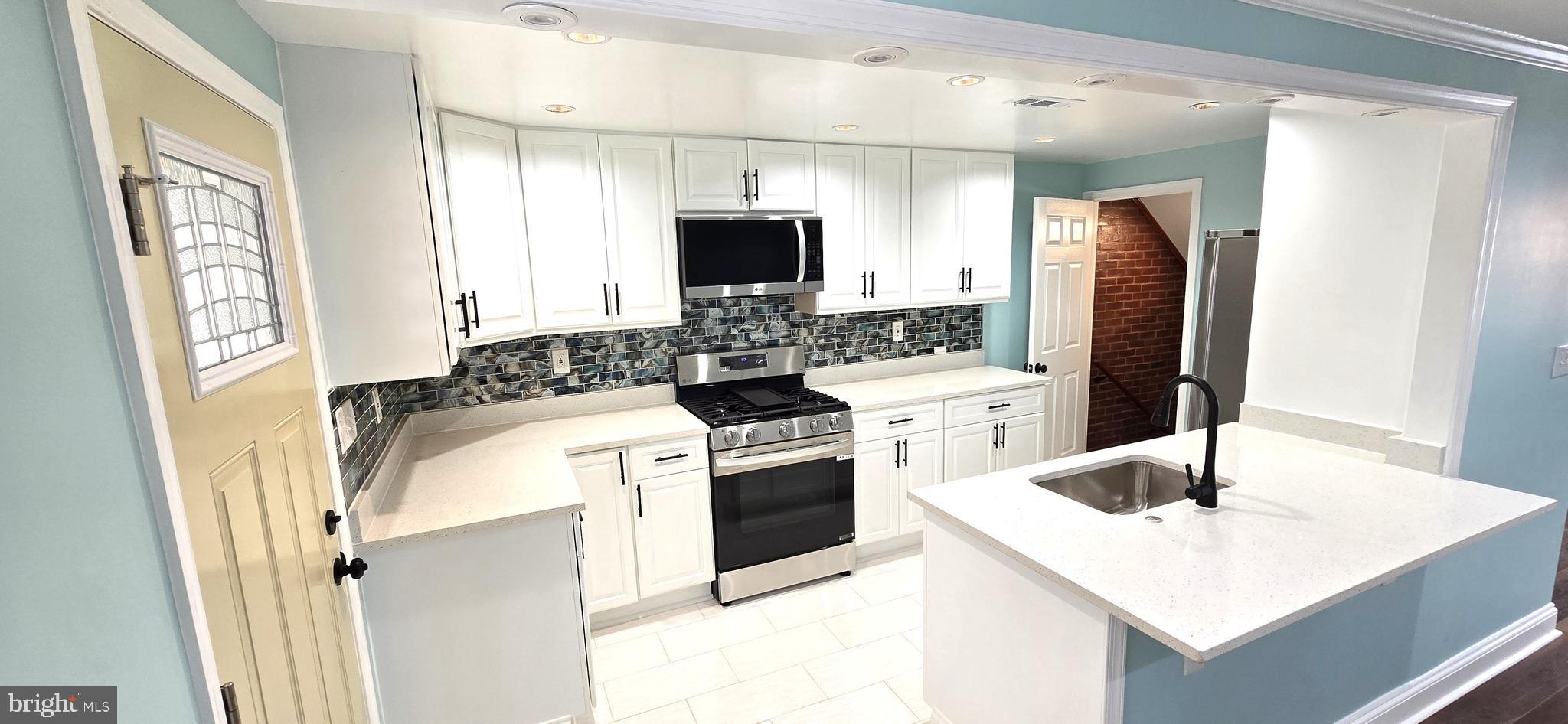 BOM 06/17/26 - The value is in the detail.  Fabulous, immaculate  5-bedroom, 2-bath townhouse.  Entire interior completely redone.  All new systems including gas heat, central air, plumbing and electrical systems,  windows and doors.  Two (2) spectacular ceramic-tile full baths.  Fully equipped kitchen with all new stainless appliances including refrigerator, dishwasher, gas stove, and microwave oven.  New front porch, spacious rear covered patio for great entertaining.  Rear parking pad.  Upper level has 3 bedrooms and a full bath.   Lower level has 2 additional bedrooms, full bath, laundry area, utility room, and rear exit.