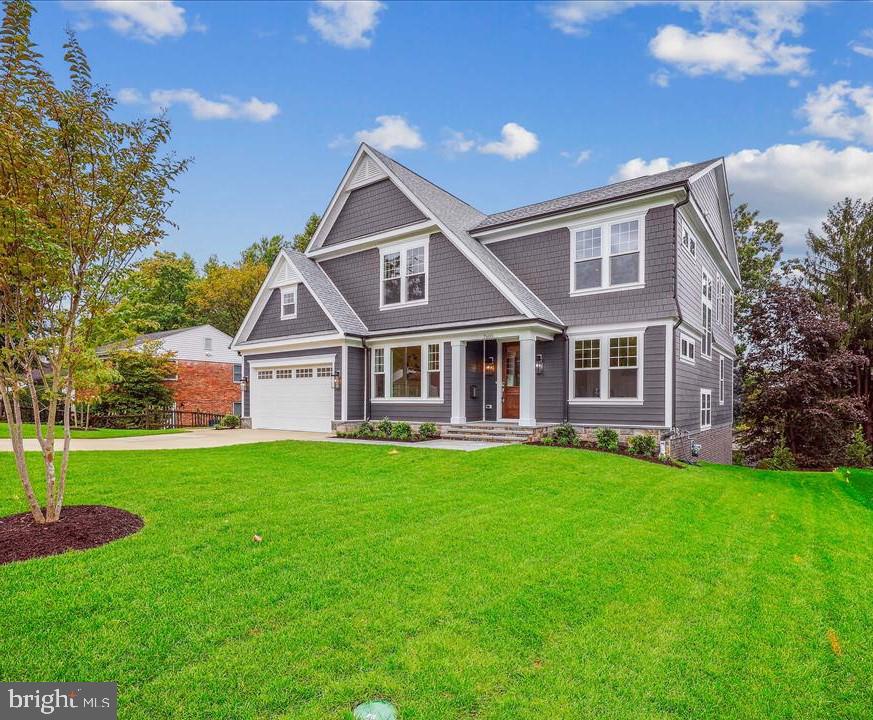 SIZE, LOCATION, TREE TOP VIEWS.  This custom, Nantucket style home by Afnan & Co. is located on an oversized lot with commanding, tree top views.  The central Bethesda location is just minutes from I-495 and downtown Bethesda.  With over 6,000 square feet of living space on three levels and a full walkout, lower level, this home features 6 bedrooms and 6-1/2 baths and is uncompromising on size and design.  The attractive shake and siding exterior leads to an expansive main level with an open layout and grand hallway, all flooded with oversized windows and natural light.  The chef’s kitchen features a breakfast island and eat-in dining table area that opens to a large, covered deck.  A formal dining room, family room, flex room and mudroom make both daily living and entertaining a joy.  A private rear foyer area leads to a main level guest suite with a full bath and walk-in closet, perfect for visiting family and friends.  The second level primary suite includes a massive walk-in closet and spa-like bathroom with a vessel tub and large walk-in shower.  Generously sized secondary bedrooms feature oversized windows, on-suite full baths, and walk-in closets.  An open second level loft, laundry room and walk-in linen closet complete the second level.  A large, lower-level recreation room features huge windows and sliding doors that lead to the rear yard with a large patio.  A game room with wet bar, exercise room, and guest/au pair suite rounds out the full walkout lower level.  Whitman HS cluster.