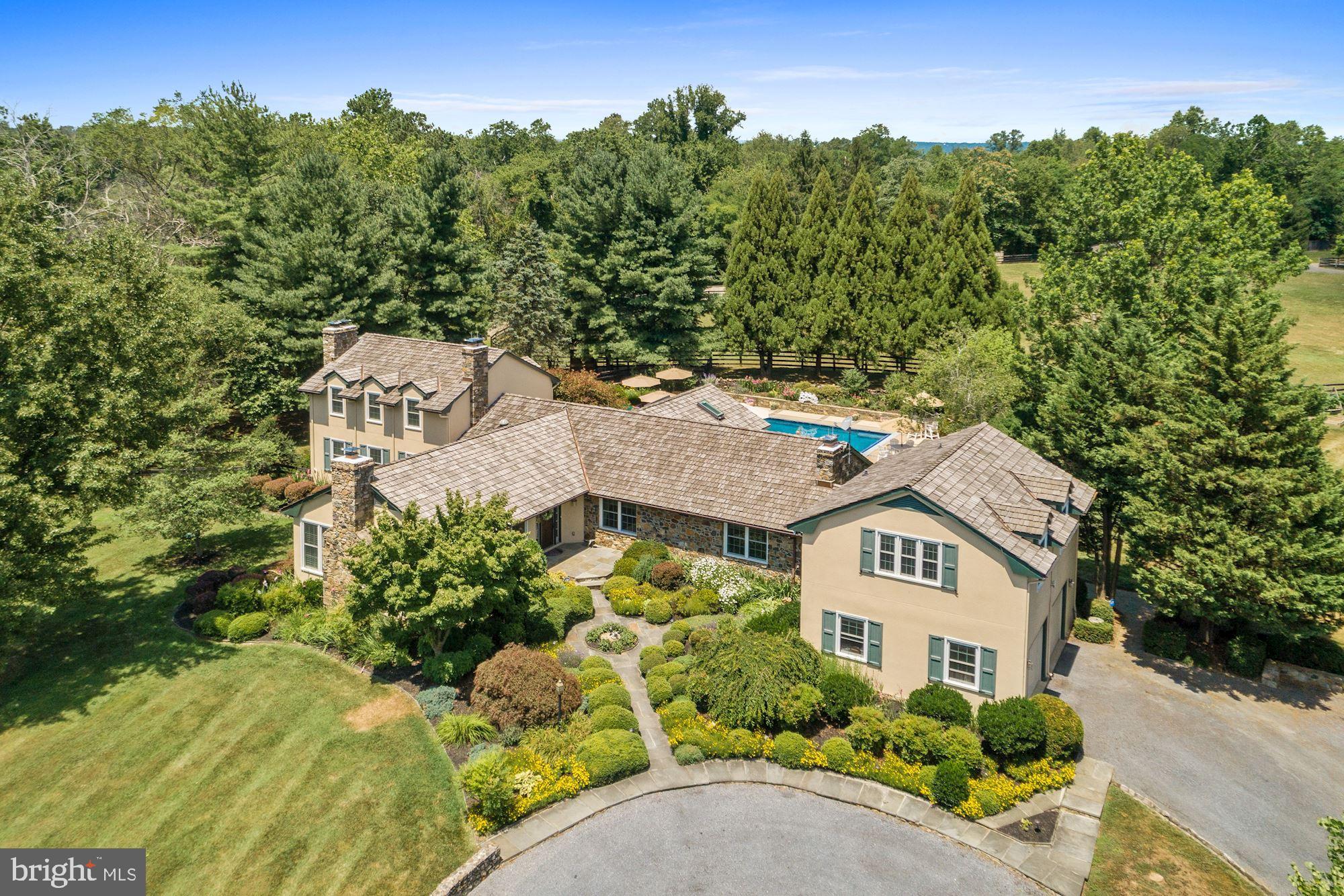 Amazing offering -Original Takaro Farm. Fabulous turn key Equestrian Estate. Main home with 3BR, 4FB & 7 Fireplaces.  Formal living and dining rooms. Large kitchen with dual ranges, wine cooler, & granite countertops. Kitchen opens up to spacious family room with stone fireplace. First floor office/study with built in bookcases. Main level Master Bedroom plus  two more ensuite bedrooms on the upper levels. Gorgeous sunroom with slate flooring  and exposed stone walls overlooks  the in ground  pool and flower gardens. Finished basement with separate apartment and private entrance.  Owners have made many recent upgrades including new roofs, HVAC systems, and a whole house generator. Equestrian amenities  are ready  for you to enjoy whether amateur or professional. . They include a 7 stall center aisle show barn that has its own office/guest quarters complete with hardwood floors and exposed beams, kitchen and a full bath. Wash stall, climate controlled tack room with half bath, separate feed, and storage/blankets rooms. Nicely laid out paddocks, run in sheds with electric and Nelson auto waters. Large riding ring constructed in 2017. Amazing ride out. Prime Piedmont Fox Hounds Territory. The property also includes an amazing pond with fountain feature, chicken coop, raised vegetables beds, irrigation system & gorgeous stone work/walls throughout the property. Potential for 3 rental income spaces. High Speed Internet. Land in easement.