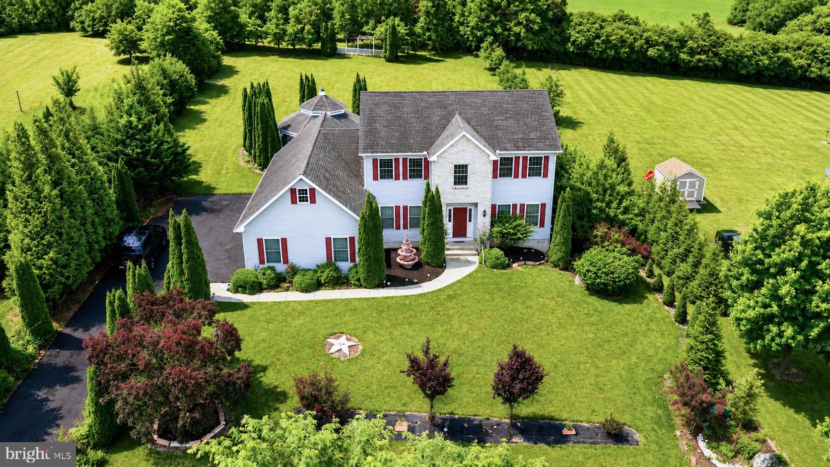 Welcome to 2760 New England Dr in Nazareth, an impressive residence set on just over an acre with refined interior features, generous living space, and exceptional outdoor amenities. This beautiful home offers 5 private bedrooms, including a convenient first-floor bedroom, along with a 3-car attached garage and a layout designed for comfort and functionality.

The living room features a gas fireplace, creating a warm and inviting setting for everyday living or entertaining. The kitchen offers stone countertops, a center island, generous cabinetry, and direct access through sliding glass doors to the outdoor kitchen and backyard retreat. A first-floor laundry room adds everyday convenience.

Upstairs, the main bedroom features a private bathroom and walk-in closet, while an additional bedroom also includes a walk-in closet for added storage and flexibility. The outdoor space is a true highlight, featuring a large gazebo, outdoor kitchen, expansive yard, and a large rear shed. With over an acre of land, impressive indoor and outdoor living areas, and a thoughtful layout, this home offers a rare blend of space, comfort, and elevated living. Schedule your showing today!