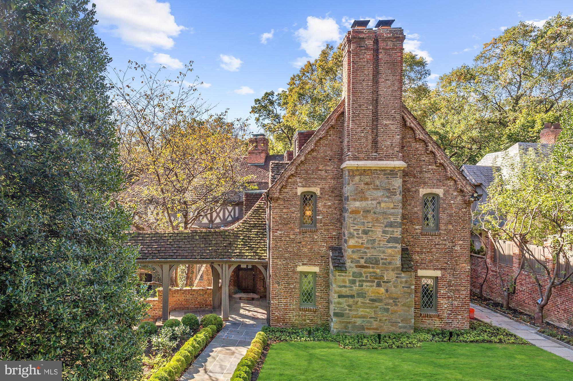 This grand 1930s residence commands a distinct curb appeal and stature with an elegant approach through a porte-cochere to the stately front entrance, lush landscaping, and motor court beyond. Countless recent updates throughout approx. 8,350 SF of Embassy-sized formal principal rooms, comfortable living spaces, period details, new professionally designed chef's kitchen. 6 Bedrooms, 6 Full + 2 Half Bathrooms, 7 fireplaces, Wine Cellar, Catering Kitchen, and more on 4-levels. The nearly Half-Acre lot includes 2-car garage and motor court, one of the most private and largest residential swimming pools (42'x20') that you will find in the District.  Must See!