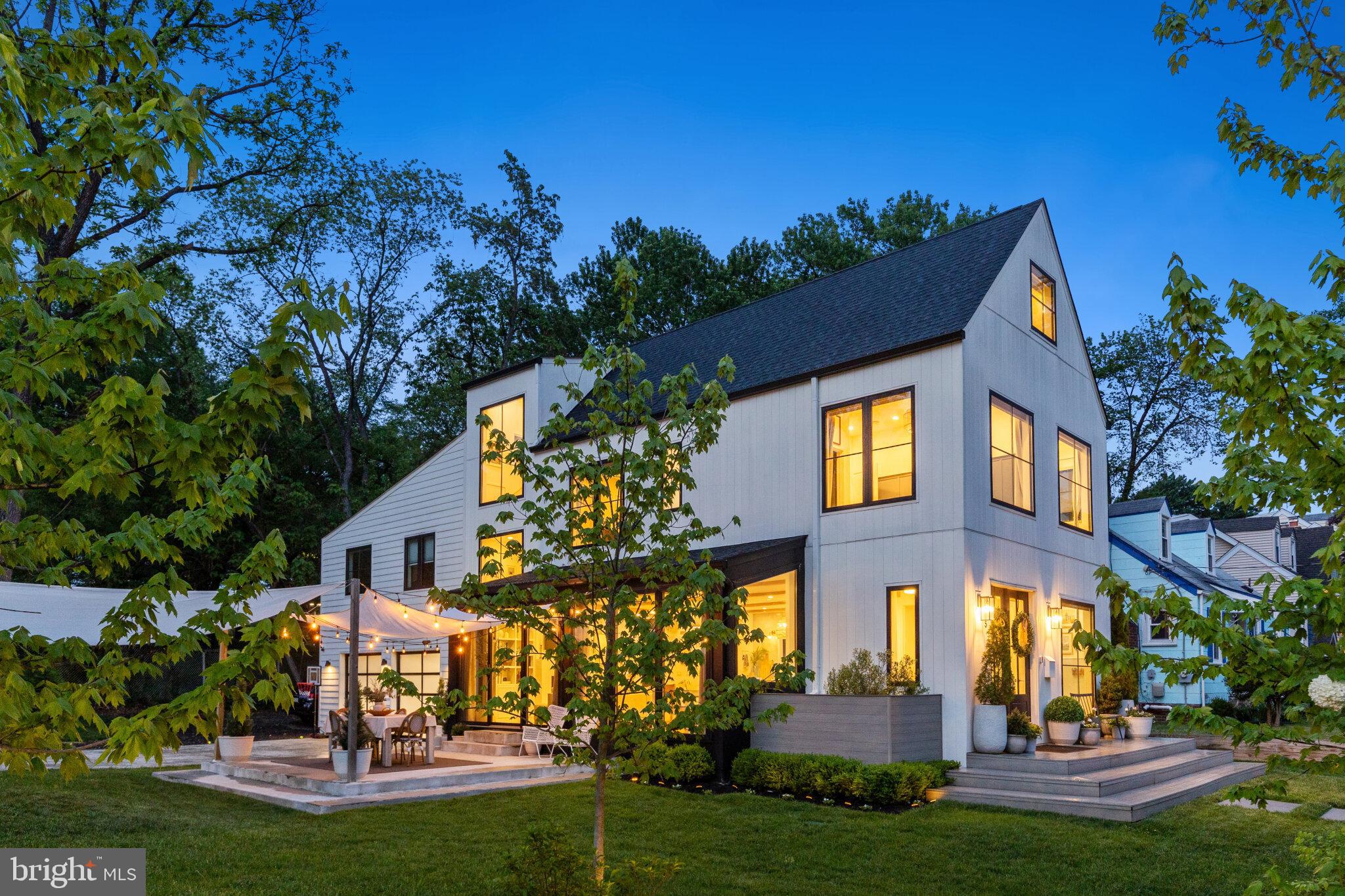 **OFFER DEADLINE FOR WEDNESDAY 5/20 AT 6PM**
Some homes are built. This one was crafted.

Tucked at the end of a quiet street in sought-after Alcova Heights, this stunning Nordic-inspired custom home stops you in your tracks before you even walk through the door. The crisp white exterior, dramatic gabled rooflines, and bold black-framed windows make a statement that's equal parts architectural and effortlessly cool.

Step inside and the design only gets better. The chef's kitchen is the heart of the home — anchored by a one-of-a-kind layered waterfall countertop that you genuinely won't find anywhere else. Framed by dramatic wall-to-wall windows, it looks out over the home's secluded corner setting, drawing in soft natural light and a sense of privacy that elevates everyday living from hosting a dinner party, to savoring a quiet morning cup of coffee. Custom brass fixtures, Moroccan and marble tile, and thoughtful built-ins carry throughout, giving every room that "did they hire a designer for this?" feeling.

The primary bath is in a category of its own — a light-filled wet room wrapped in floor-to-ceiling tile that feels more like a luxury treehouse retreat than a bathroom. You may never want to leave.

Outside, the fully fenced yard with an automatic driveway gate and irrigation system, is ready for everything — summer evenings under string lights, kids on the in-ground trampoline and play set, and weekend gatherings on the patio. And the location? Unbeatable. Open green space next door, a scenic creekside trail to the neighborhood park right across the street, and Washington, DC just minutes away.

The cherry on top: a fully separate modern apartment above the garage with its own private entrance, ideal for rental income, guests, in-laws, or a work-from-home setup that actually feels like getting away from it all.

Homes like this don't come around often. Design-forward, move-in ready, and perfectly positioned, this is the one.