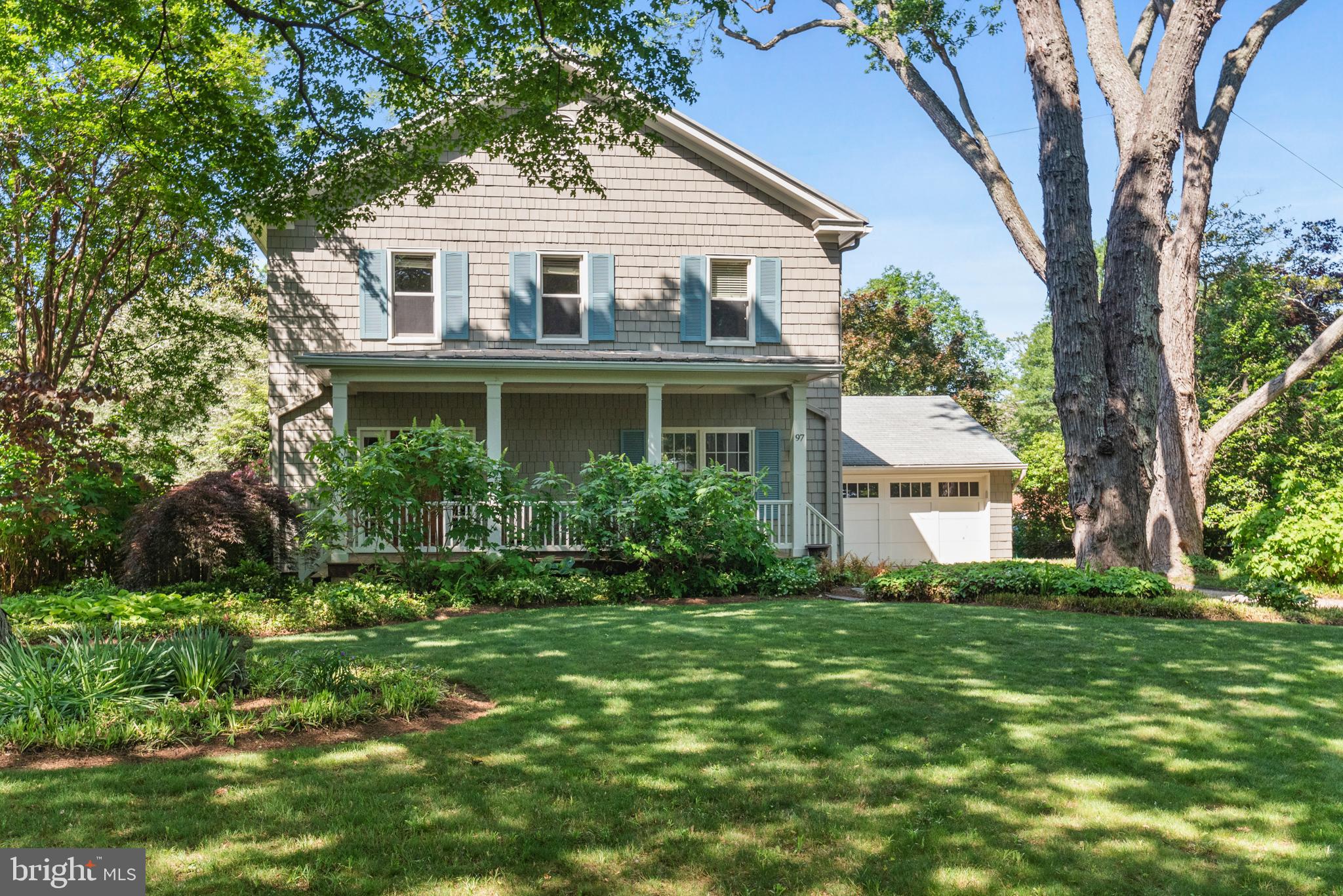 A rare gem in a peaceful oasis in the heart of Eastport. This classic 1930's home is set in among an enclave of seven homes that are nestled along the shores of Spa Creek. A charming gravel drive winds through the cluster of homes that access a private path down to the new marina, built in April 2025. The lush front yard and mature trees lead to the classic front porch that offers the ideal place to greet your neighbors or relax in the shade. The traditional wood floors flow throughout first and second floors. Formal dining is perfect for dinners with family or friends. The island kitchen offers casual entertaining space, tons of cabinets and access to the back deck and private yard. A direct path to the two-car garage will make it easy to bring in groceries right into the kitchen! The living room has loads of light and a fireplace for the chilly nights. The landing with bookcase leads to wide steps to the second floor. The primary suite is large with two sinks and a glass walk-in shower. The guest bedroom offers additional closet space and has its own full bath. The laundry is located on the second floor. Stair leads to an attic that could be expanded for more sleeping areas.  All the charm of Eastport access with restaurants and shops within walking distance. A private marina with new docks and finger piers for your sail or power boat, kayak or paddle board...summer fun awaits! This peaceful private neighborhood offers a rare opportunity for the ideal Annapolis lifestyle...