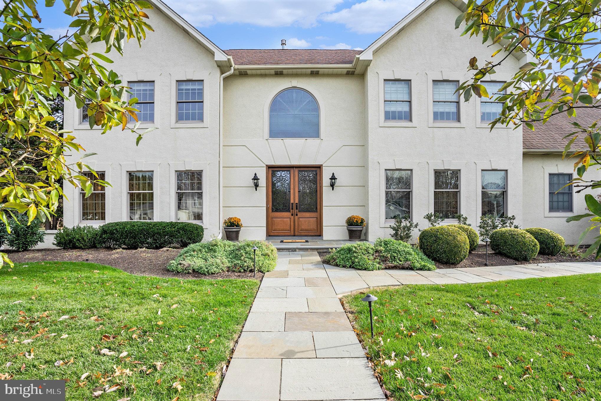 Welcome to this exquisite residence nestled in the sought after Upper Dublin-Dawesfield community.  Recently renovated throughout, this home boasts an impressive curb appeal featuring a striking Paladium window, solid wood double doors adorned with iron-detailed glass, and enchanting hardscape walkways illuminated by tasteful lighting. Upon entering through the two-story foyer, you’ll be greeted by gleaming hardwood floors and impeccable millwork showcasing elegant columns and archways and an impressive turned staircase. The living room and dining room, adorned with recessed lights, a gas burning fireplace, and hardwood floors with a stylish carpet inlay, offer spacious and inviting areas perfect for hosting gatherings and entertaining guests. The glass pocket doors lead you into the exceptional library/study, a truly special space with patio access, ideal spot to relax and enjoy the outdoors. The great room boasts a vaulted ceiling, recessed lights, hardwood floors, and an array of captivating windows, creating an inviting ambiance perfect for unwinding with music from the surround sound system that graces multiple rooms in this home. The great room seamlessly flows into the exceptional gourmet kitchen, a chef’s dream equipped with a granite island, tile floors, stainless steel appliances including two ovens, a microwave, a 6- burner cooktop, a warming drawer, dishwasher and complemented by a butler pantry/wet bar or coffee station with wine/beverage refrigerator, attractive glass cabinets with lights. Adorned with ample cabinets and a charming tumbled marble backsplash, this kitchen is a culinary haven. Adjacent to the kitchen, the breakfast room and outdoor patio provide delightful spaces for savoring morning coffee or hosting barbeques with friends. Completing the first floor is a customized mudroom/laundry room, powder room, and a three-car garage with newer garage doors.  On the second floor, discover the expansive main bedroom, a haven of comfort and luxury. The recently renovated main bath is a sight to behold, featuring a generously sized double tile shower and an array of exquisite details that elevate the space to unparalleled levels of refinement. Step into the vast customized walk-in closet through frosted glass double doors, an organizer’s dream that connects to an additional space, offering versatile possibilities. This adjoining space, adorned with extra built-in closets, presents an opportunity for an additional office or a serene retreat, further enhancing the functionality of this remarkable home. The second floor also hosts three other generously proportioned bedrooms, each offering ample space and comfort. Among them, a charming princess suite boasts a private bath, providing secluded and comfortable space for guests or family members. Additionally, a large hall bathroom with double sinks cater to the needs of the household with convenience and style. The lower level, where entertainment and relaxation thrive. This remarkable basement is an entertainment haven, boasting a wet bar and media room, complete with home theater,  great spot to hangout and watch the games with friends and family. The convenience continues with a full bathroom, ensuring comfort for guests and enhancing the functionality of this lower level retreat. A dedicated fitness room caters to health enthusiasts, providing space for workout and wellness routines within the comfort of your own home. Offering both convenience and accessibility, Bilco doors lead seamlessly to the outside, allowing easy access. This home is equipped with two-zone HVAC systems, ensuring optimal comfort throughout, regardless of the season. Additionally, a newer whole house generator provides peace of mind during unforeseen circumstances, a  newer custom shed,  a newer roof stands testament to the meticulous care and maintenance this home has received. This property has approx 5,000sf including the finished basement. Don't miss out on this amazing home!