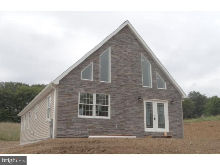 New construction chalet. Open concept layout with 2 story living room dining room & kitchen 2 possible master suite--one on main floor or on 2nd floor. Engineered hardwood in main living areas. Granite counters in kitchen. Cultured marble in bathrooms. Rough-in plumbing for bathroom in basement area to finish off for family room/additional living space.  Beautiful stone exterior in front. 2 driveways & ample parking on upper & lower level. Taxes are land value only.
