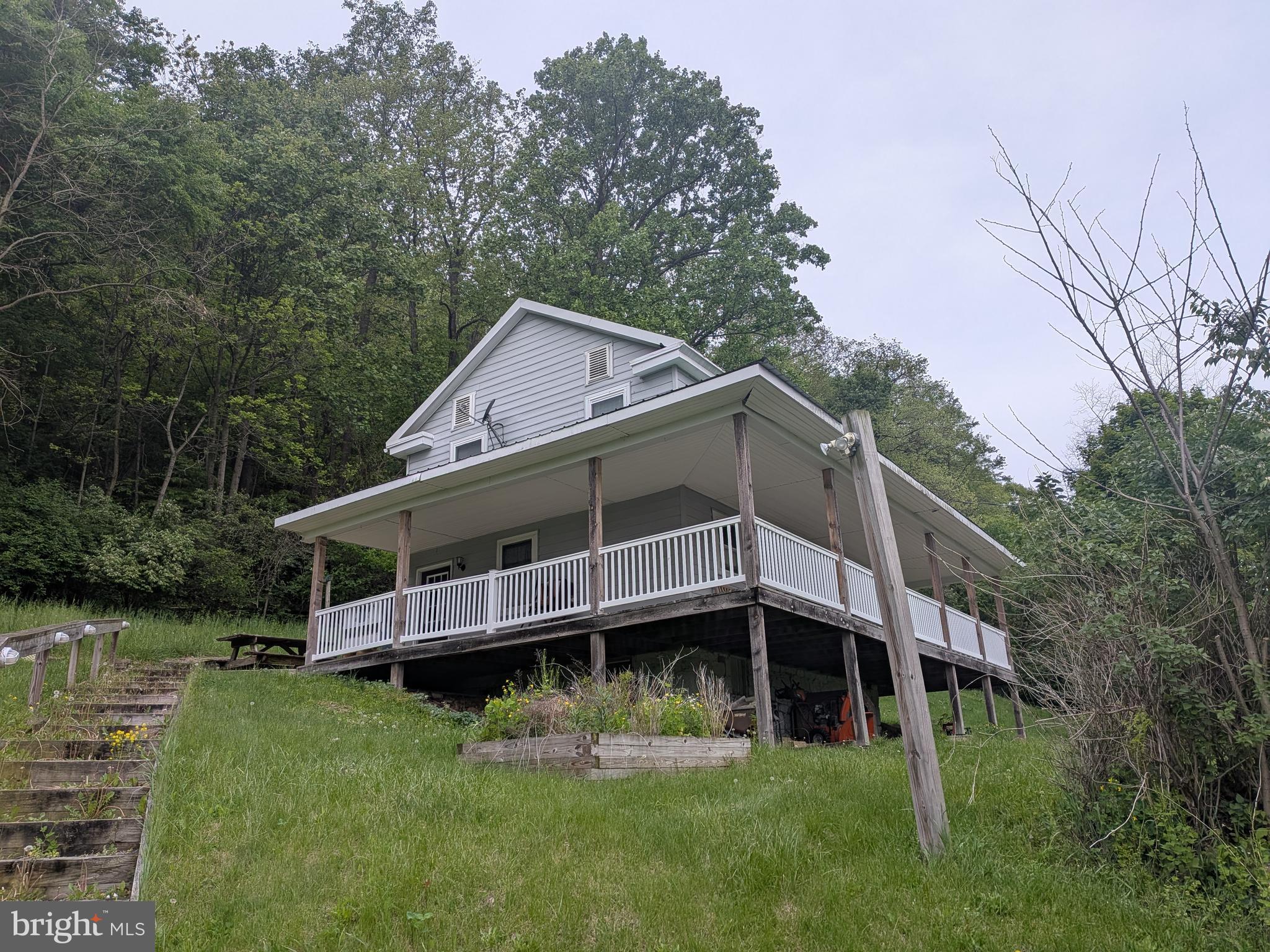 Don't let the small square footage fool you, this place has a lot to offer.  The open layout, 3 bedrooms, and 1.5 baths provide plenty of room for you and your family.  On top of that, with 6 acres, there is plenty of room to expand the home in the future.  Entertainment space galore on all four sides of the house and with both huge side yards.  If that isn't enough, hike and explore your 6 acres on the side of the beautiful ridge.  All of this is conveniently located just outside of Mifflin and Mifflintown.  You will be less than 5 minutes from the community pool, schools, groceries, and other conveniences.  In addition to that, you are less than 10 minutes from Route 322.  Call today for your personal tour.
