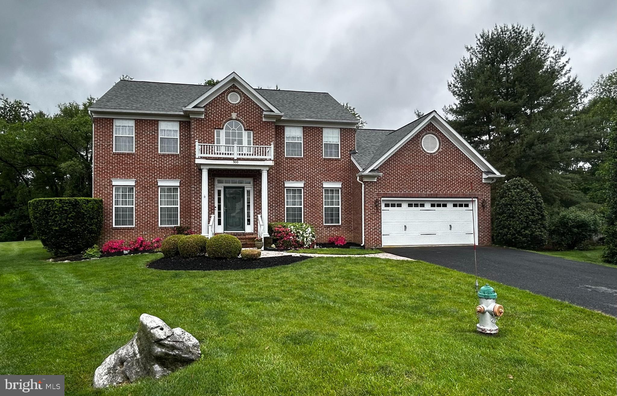 This stately brick Colonial with front porch columned portico features a  Cathedral ceiling wood floored family room  with a fireplace & a hardwood floored library/office both with custom designed Castleman Company cabinetry featuring hidden wiring & Television mount. This incredible home also features both a formal living & a formal dining room with custom made rugs overlaying lovely refinished hardwood floors, a huge gourmet kitchen with island, lots of custom cabinetry, built in desk,  granite & stainless steel appliances with separate breakfast room area with tiled floors, along with a gigantic screened in porch  off the  big family room & also features a new patio too off of that! The large two story entry foyer features a hard wood stairwell complete with new removable runner pads! This pretty home also boasts 4 large upstairs bedrooms complete with a master suite featuring a custom designed luxury master bath. This beautiful home also has an attached oversized 2 car garage entering into a doored mudroom/laundry room complete with full size washer & dryer.  This gorgeous home is located on a  private cul de sac lot backing up to a tree lined backyard featuring lots of mature landscaping perfect for your outdoor garden parties! This home  offers easy accessibility  for its inhabitants  &  has a nice circular floor plan for enjoyable living & entertaining! Also, the enormous walk out basement is already set up as a workshop with plenty of room to finish off part or all of it with various rooms, plumbed bathroom, theatre room, or whatever you care to create! This regal home is move in ready with wood floors refinished throughout main level  except for tiled flooring in the kitchen are & has been freshly painted throughout the spacious home. It also features many interior wood blinds & some remote control ones in the bright kitchen area & had a new roof replaced last year in 2025! This neighborhood is conveniently located within Battlefield Estates which has NO HOA/NO Home Owners Association! All of this with easy access to many major commuter/traveling routes, shopping, restaurants & much more! Don't miss out on the opportunity to make this beautifully designed one original owner home your next happy place to live!