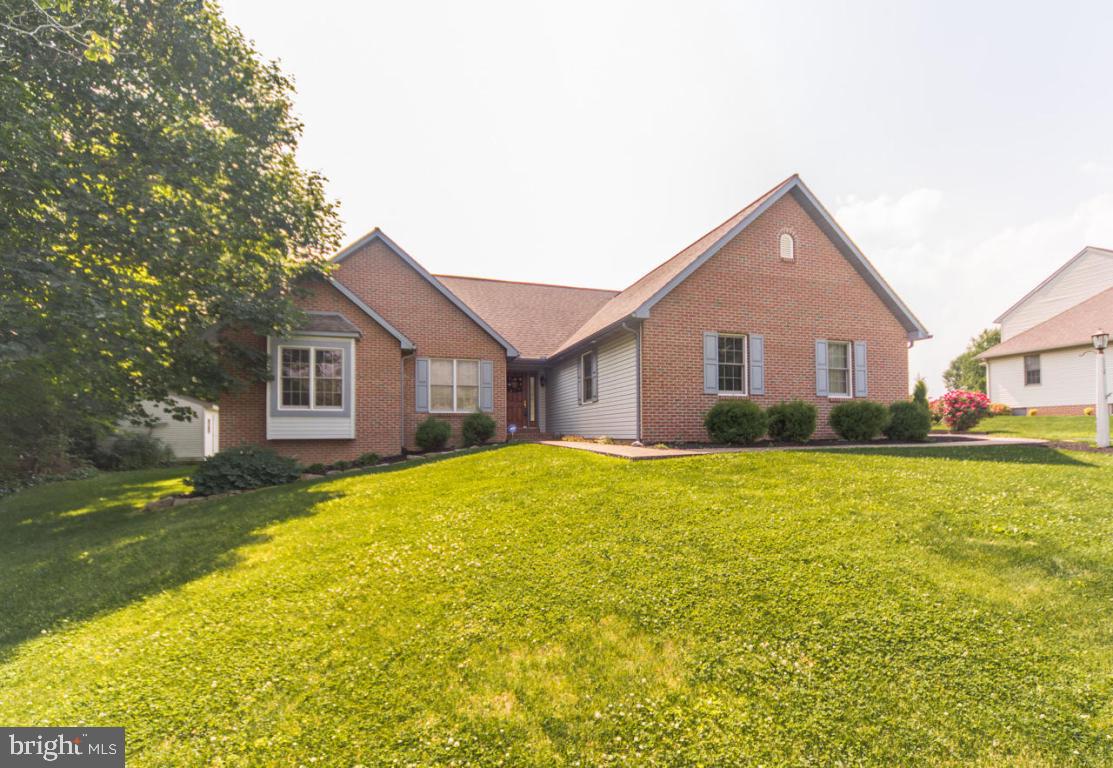 SOLID BRICK RANCHER WITH GAS HEAT AND SOARING VAULTED CATHEDRAL CEILING GREAT ROOM WITH BRICK FIREPLACE. CERAMIC TILED EAT IN KITCHEN WITH ISLAND. CONVENIENCE OF FIRST FLOOR LAUNDRY & FIRST FLOOR MASTER WITH  DOUBLE BASINS IN BATH AND AGAIN CATHEDRAL CEILING IN MASTER. BATH.  LOWER LEVEL IS PARTIALLY FINISHED AND  ROUGHED IN FOR BATHROOM , WOODSTOVE  AND HAS A BILCO DOOR FOR EASY EGRESS.CLOSE TO THE RAILS AND TRAILS IN LITITZ.