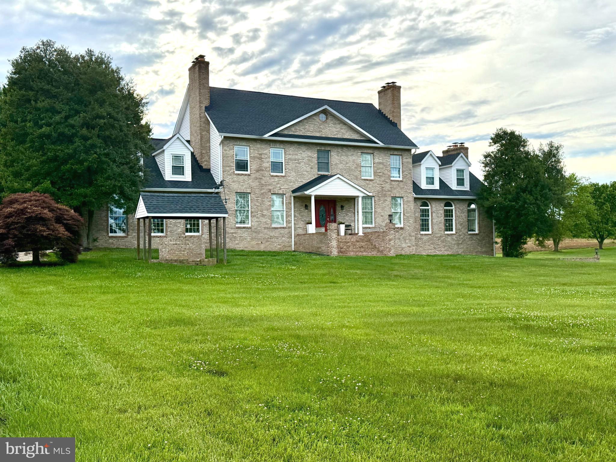 **Grand Colonial Retreat on 2.85 Private Acres – A Rare Opportunity!**

Welcome to **75 W Bay Front Rd**, a stately all-brick Colonial offering over **6,000 square feet** of beautifully designed living space on nearly **3 private acres** in desirable Lothian, Maryland. This impressive **6-bedroom, 3.5-bath** residence perfectly blends timeless elegance with modern comfort.
Step inside to discover expansive living spaces, classic architectural details, and **five fireplaces** creating warmth and character throughout. The heart of the home is a spacious, updated kitchen featuring beautiful renovations—perfect for everyday living and effortless entertaining. Renovated bathrooms add modern luxury and style throughout the home.
The thoughtfully designed floor plan offers multiple formal and informal gathering spaces, ideal for hosting family and friends. A private **au pair/in-law suite with separate entrance and full amenities** provides exceptional flexibility for multigenerational living, guests, or extended stays.
Outside, enjoy beautifully landscaped grounds, abundant privacy, and endless possibilities across **2.85 acres**—all while being conveniently located near major commuter routes, shopping, dining, and the Chesapeake lifestyle.
**Bonus:** Assumable loan available at **4.25%** for qualified buyers.
This is more than a home—it’s a lifestyle.