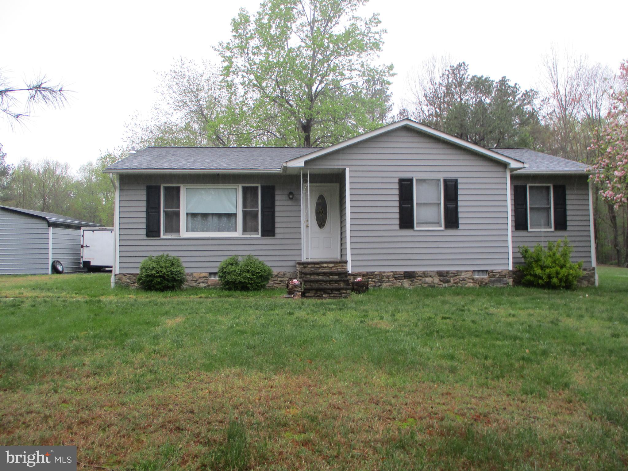 One level rambler on an acre lot ready for a new tenant.  Remodeled kitchen with granite counters, island w/seating, stainless appliances, and dining area.  Large living room with lots of windows and natural light.  Primary bedroom with primary bath.  Two additional bedrooms and one additional full bathroom.  Large deck, storage shed, and carport.  Home can be rented with furnishings as seen or items can be removed. 
 Close to area amenities, schools and shopping.