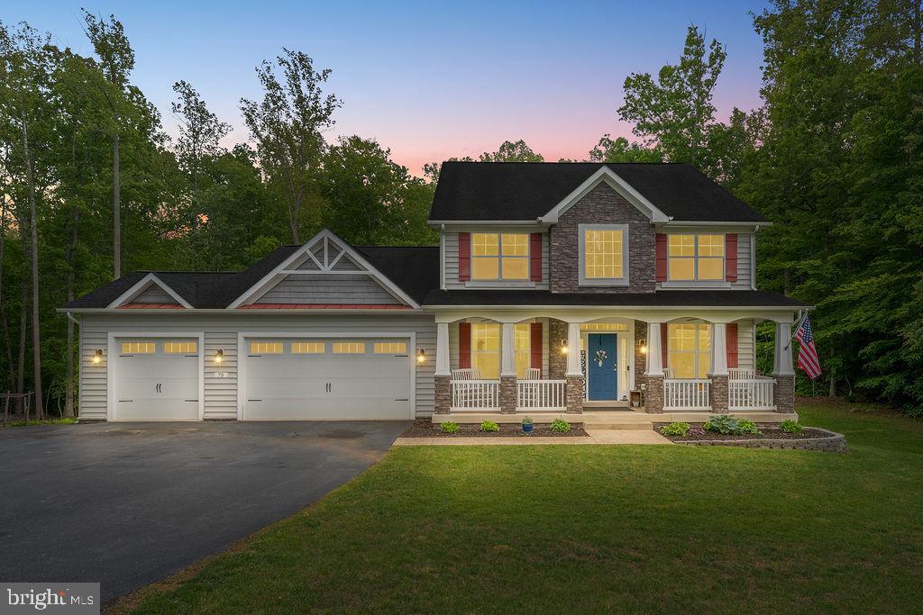 Welcome to the perfect blend of space, comfort, and peaceful surroundings. This home offers nearly 6,000 square feet of finished living space across three levels, all designed with flexibility and function in mind. It sits on 6.6 acres that provide both privacy and room to breathe.
From the moment you arrive, the full front porch sets a welcoming tone—ideal for morning coffee or unwinding at sunset. Inside, the open-concept main level is designed for both everyday living and effortless entertaining. The spacious kitchen features a large center island that opens into the family room with gas fireplace, creating a natural gathering space. Just off the kitchen, a maintenance-free deck overlooks the expansive backyard and wooded views.
The main-level primary suite offers comfort and convenience, providing a private retreat tucked away from the rest of the home.
Upstairs, you’ll find three additional bedrooms, two full bathrooms, and a second family room—perfect for a media space, playroom, or quiet lounge area.
The fully finished walk-out basement expands the home’s versatility even further, featuring a third family room with a wet bar, two additional bedrooms, and a fourth full bathroom. With direct access to the patio, this level offers excellent potential for an in-law suite, guest quarters, or extended living space.
Outdoors, the fenced rear yard backs to mature trees that offer walking trails, a bird sanctuary, and a dedicated fire pit area—creating a private setting for both relaxation and recreation. A three-car garage and oversized driveway adds practical convenience. While the overall setting delivers a peaceful, country feeling, it remains within an active and thriving county location.

This home offers the rare opportunity to enjoy generous space, natural beauty, and modern comfort—all in one exceptional property.