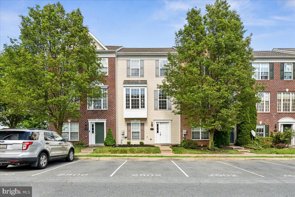 PROFESSIONAL PHOTOS WILL BE ULOADED WEDNESDAY JULY 22nd! TUNE BACK IN!! Welcome to this beautifully updated three-level townhome in Whittier, one of Frederick's most premier and sought-after communities! Whittier residents enjoy multiple outdoor pools, ample walking paths and a park for recreation. There is also a community BBQ restaurant, pizza place, hair salon and liquor store, all walking distance to the property. From the moment you enter, the brand new Luxury Vinyl Plan(LVP) flooring and freshly painted interior create a bright, move-in ready feel throughout. The entry level offers a versatile bonus living space or rec room, a full bedroom with a private ensuite bath, a laundry room, and a walk-out to the backyard. The rec room area is exceptionally unique as the ceiling height in the rear of the basement is 10+ feet, creating an unparalleled feel.  It could be a perfect home theatre or golf simulator room! The main level impresses with an open, airy layout featuring new LVP flooring from front to rear, an eat-in kitchen with updated quartz countertops and brand new stainless steel stove and refrigerator, and easy access to the rear deck, ideal for morning coffee or evening entertaining. Upstairs features three generously sized bedrooms and two full  baths, providing comfort and space for the whole household. The primary suite has a vaulted ceiling, walk-in closet, en-suite bath and rear view. The two additional bedrooms are supported by a hall bath. The Whittier community elevates everyday living with an outdoor pool, tot lots, a scenic pond, and local dining all just steps away, with unbeatable access to Rt. 15, I-270, and I-70 for an effortless commute in any direction  and Downtown Frederick and Fort Detrick just minutes from your front door. This one checks every box, don't miss it!